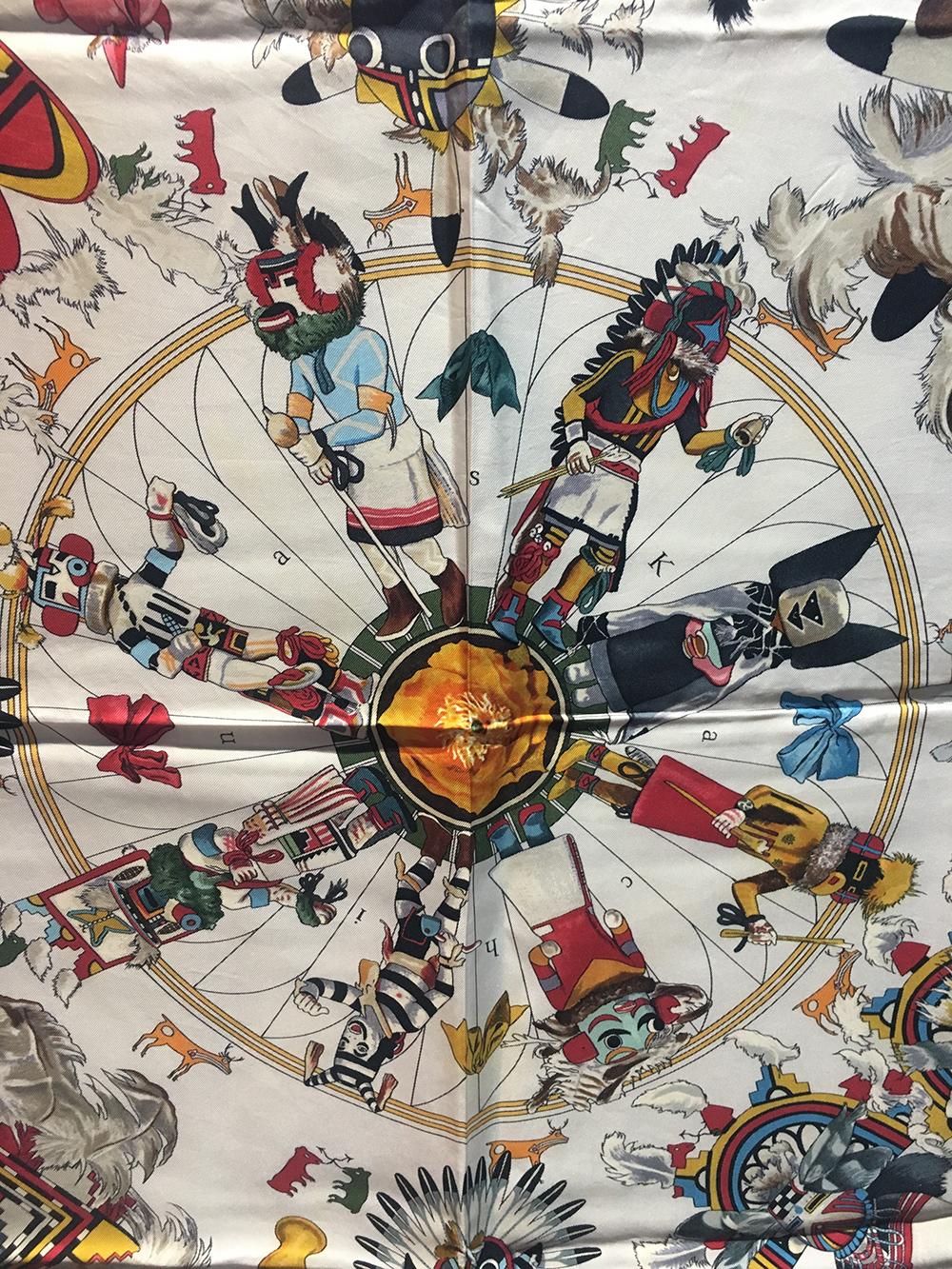 RARE Hermes Vintage White Kermit Oliver Kachinas Silk Scarf c1990s in excellent condition. Original silk screen design c1992 by Kermit Oliver features various mutlicolor native american chiefs and people in traditional dress over a white background