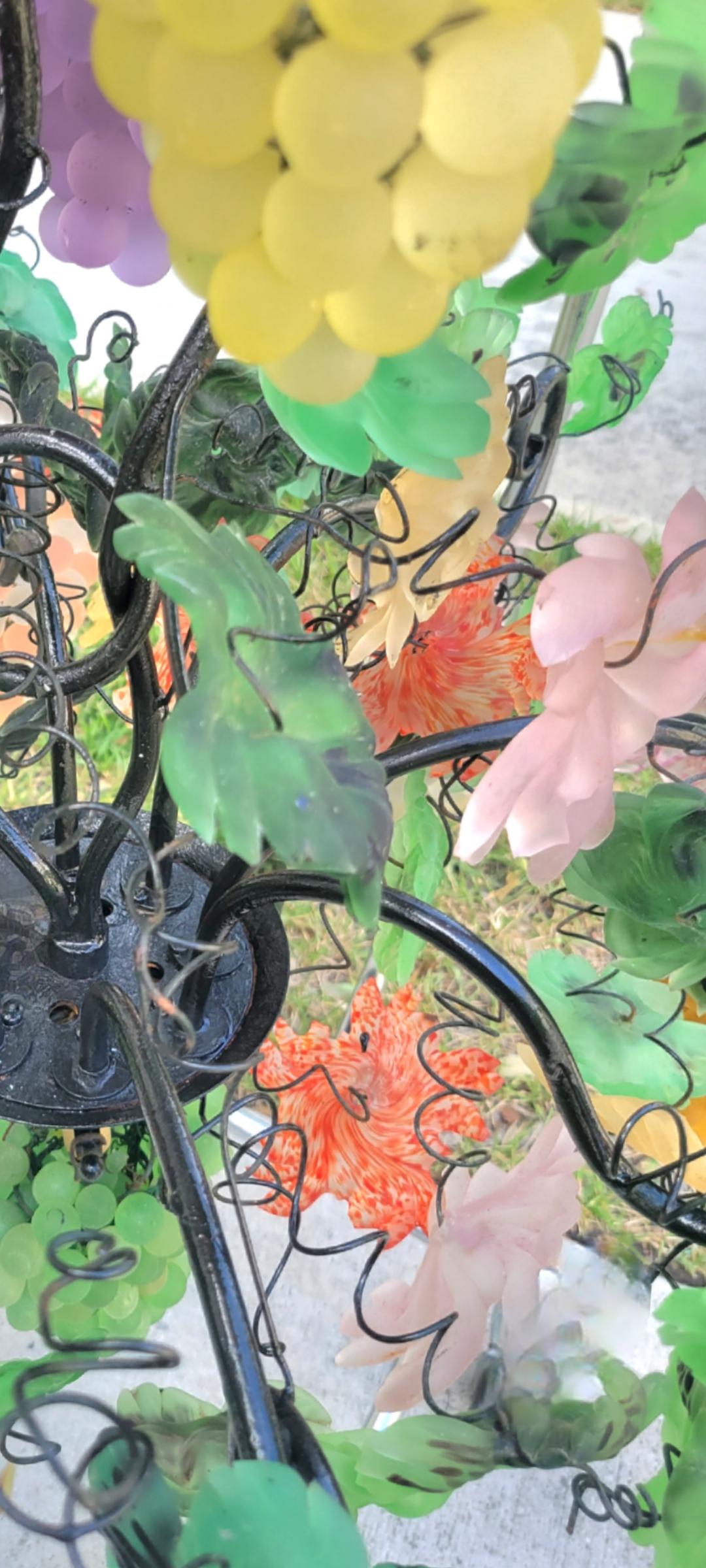 Cesare Toso was a famous Murano blown glass artist known for designing and producing intricate glass chandeliers, particularly those featuring grape clusters and leaf motifs. He was associated with the Toso glassworks in Murano, Italy, and his