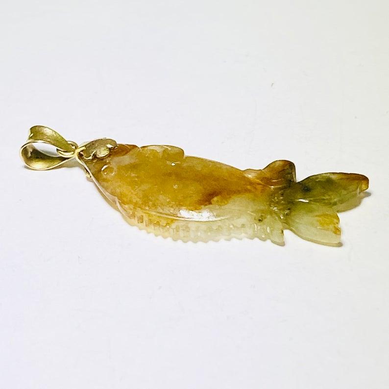 Protection for yourself! This is an awesome rare fish pendant! The jade is a very unusual type of transparent jade that allows the light to pass through it! Fish are known to give good luck when worn and jade is known to protect the wearer from