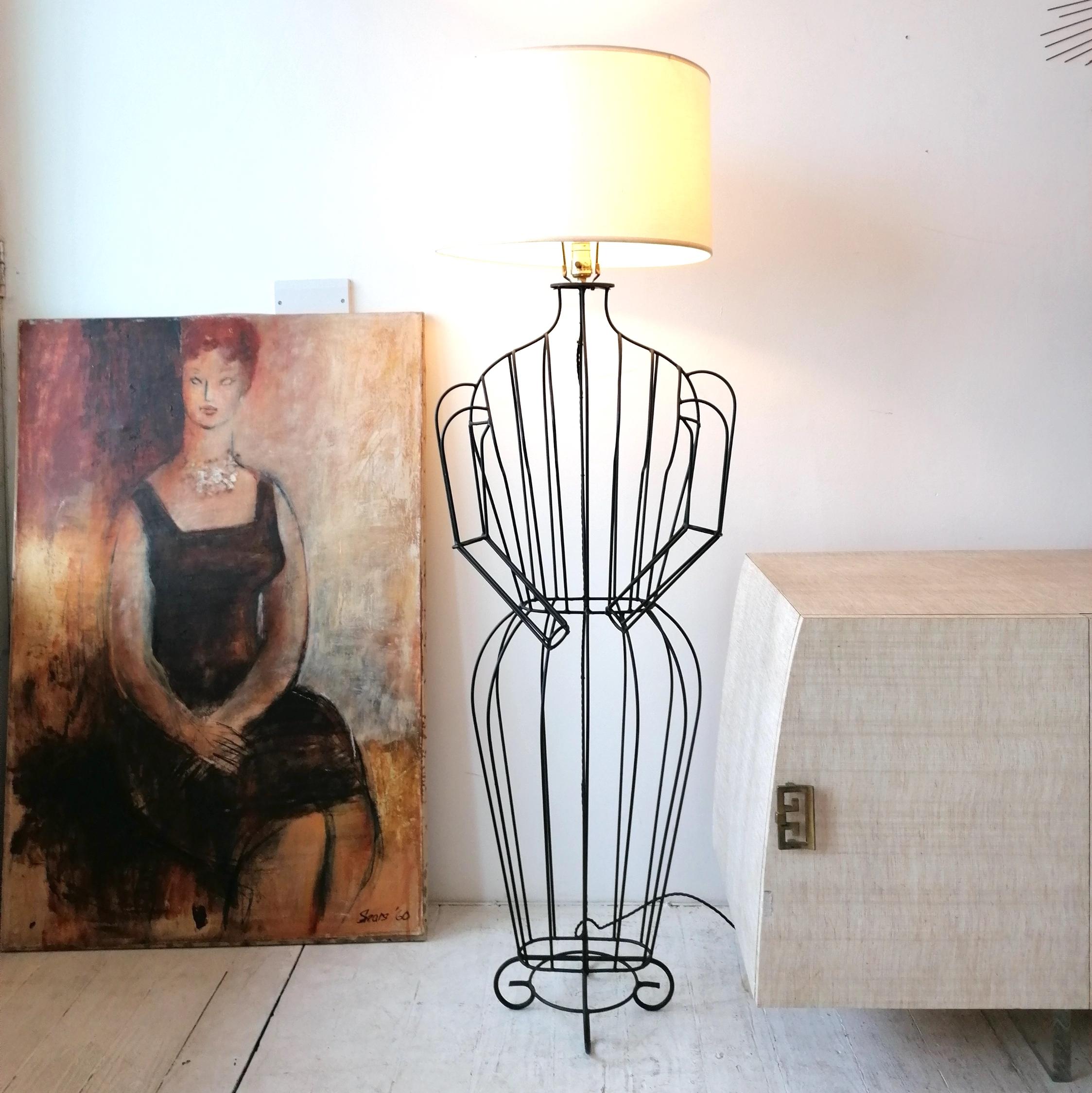 Rare quirky mid century John Risley figural 'Mannequin' floor lamp, USA 1960s. Black iron wire construction. Newly rewired with braided cord.
Lampshade included- this has a little surface dirt.

Dimensions: height to top of shade harp 149cm, width