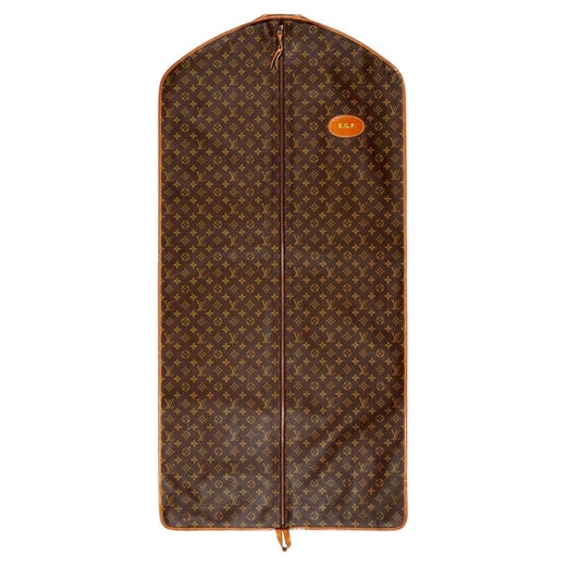 Vintage Louis Vuitton garment bag suitcase for suits with LV monogram. ht.  40in., wd. 22in. sold at auction on 15th July