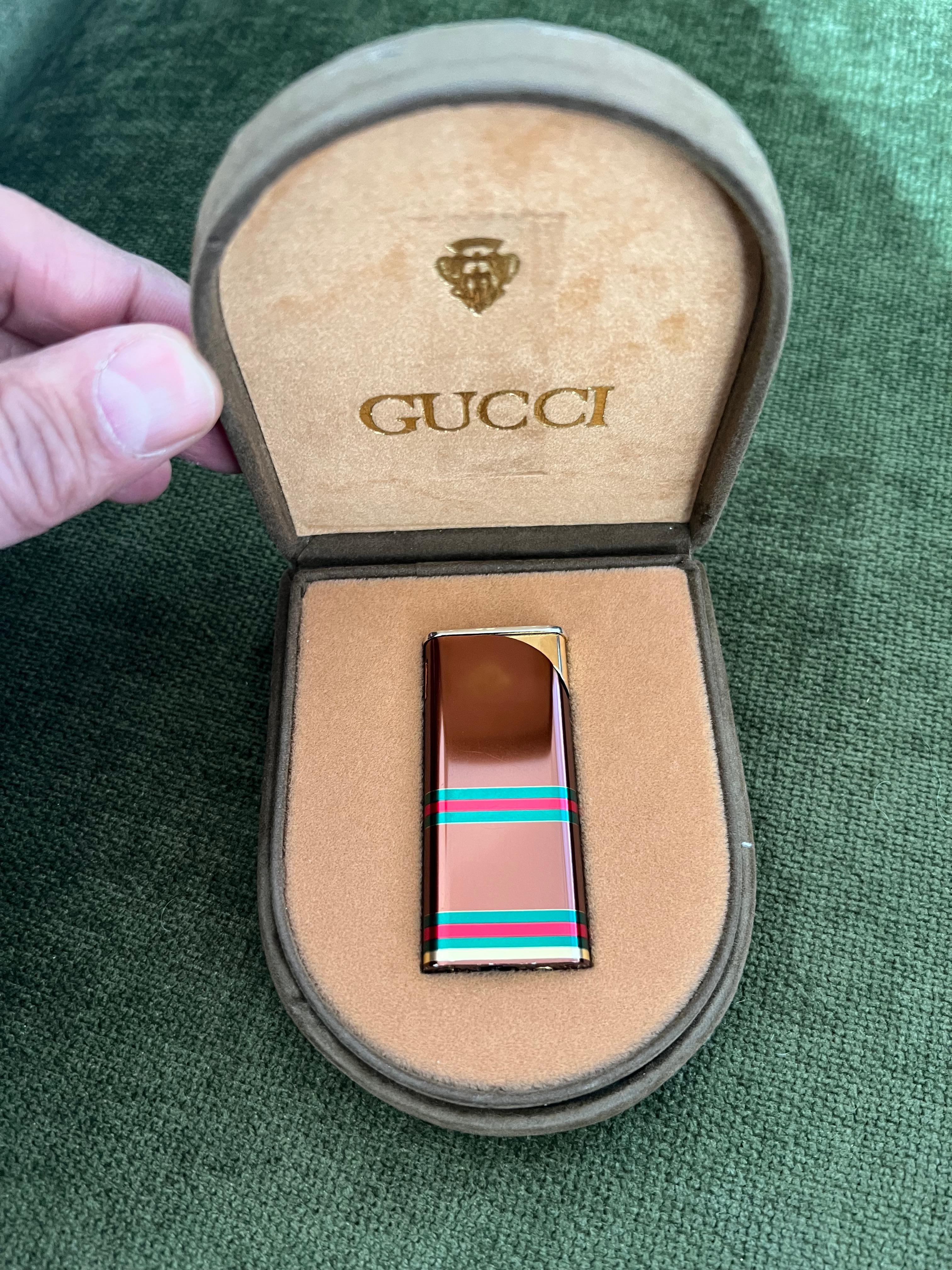 Very rare authentic vintage Luxury Gucci lighter, Florence Italia 80s. 
Beautiful Finish Gucci lighter, with the green, red stripe 
Comes with original case and stamp manufacturing tax Ignition appliance of those beautiful years. 
All signed! 
In