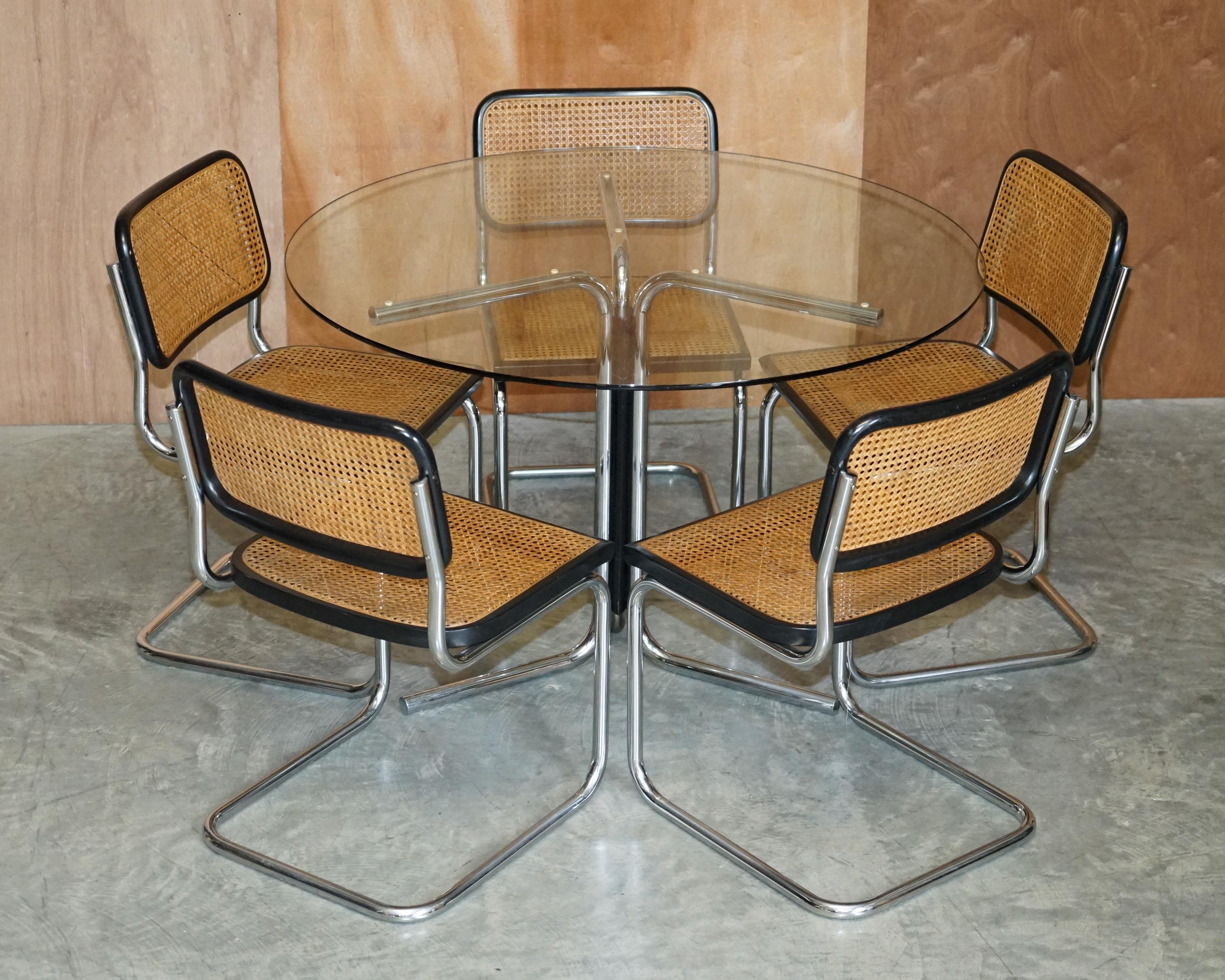 We are delighted to offer for this stunning vintage made in Italy stamped Marcel Brueur suite of five Cesca chairs with matching chrome and glass table

A very good looking and well made suite. These chairs are pretty much one of the most iconic