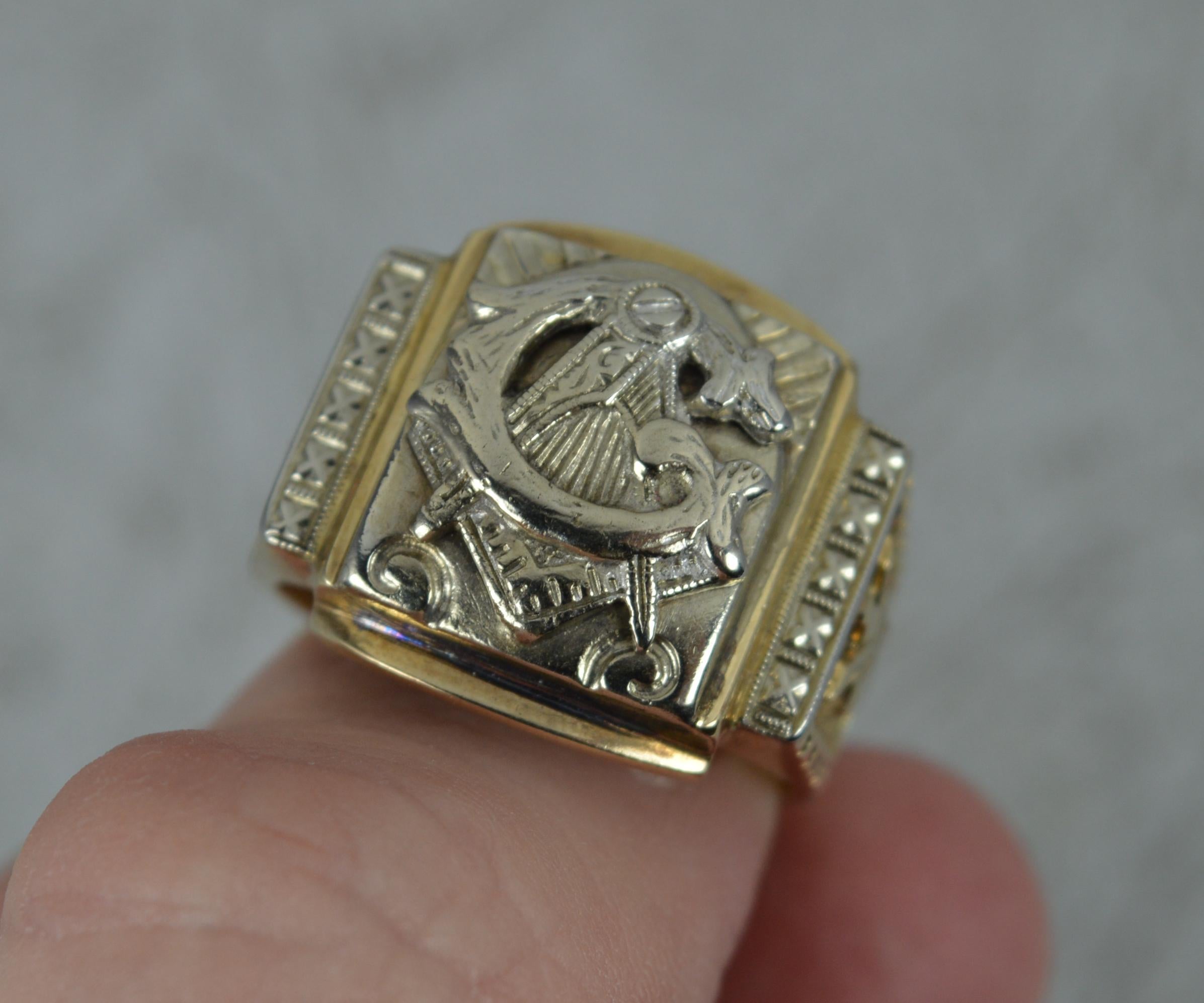 A Masonic signet ring.
Solid 10 carat gold example. Yellow gold shank and white gold head setting.
Designed with the Masonic emblem to centre with initial G entwined.
14mm x 17mm main central section.

Condition ; Good for age. Clean band. Light