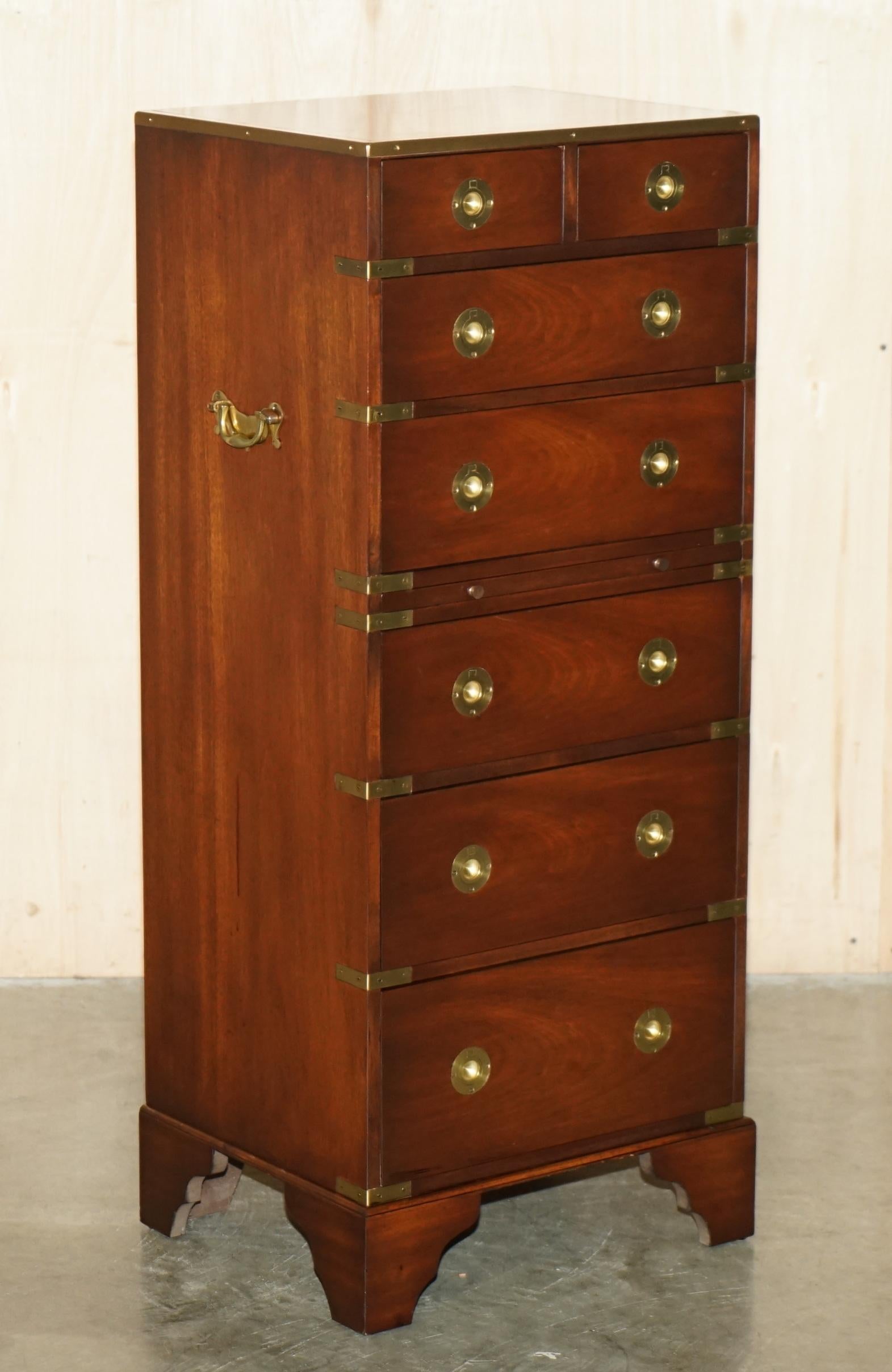Royal House Antiques

Royal House Antiques is delighted to offer for sale this stunning, hand made in England Vintage Military Campaign tallboy chest of drawers with green Leather gold leaf embossed slip serving tray 

Please note the delivery fee