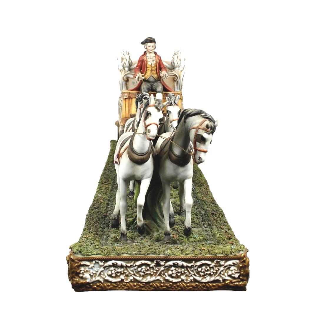 Rare Vintage Monumental Porcelain Horse Drawn Victorian Carriage centerpiece group

Capodimonte Porcelain, after a model by Giorgio Galletti 
Naples, Italy; second half of the 20th century
Porcelain

Approximate size: 37 (w) x 15 (h) x 10 (d)