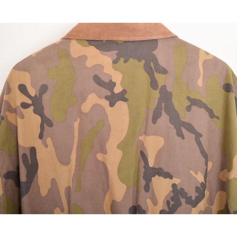 Rare Vintage 1980's Moschino Milano long sleeved, loosely oversized fit camouflage bomber jacket with a brushed leather collar and gently elasticated waist band.

MADE IN ITALY !

Features:
x2 Front multi-way pockets
Gently elasticated wrist cuffs &