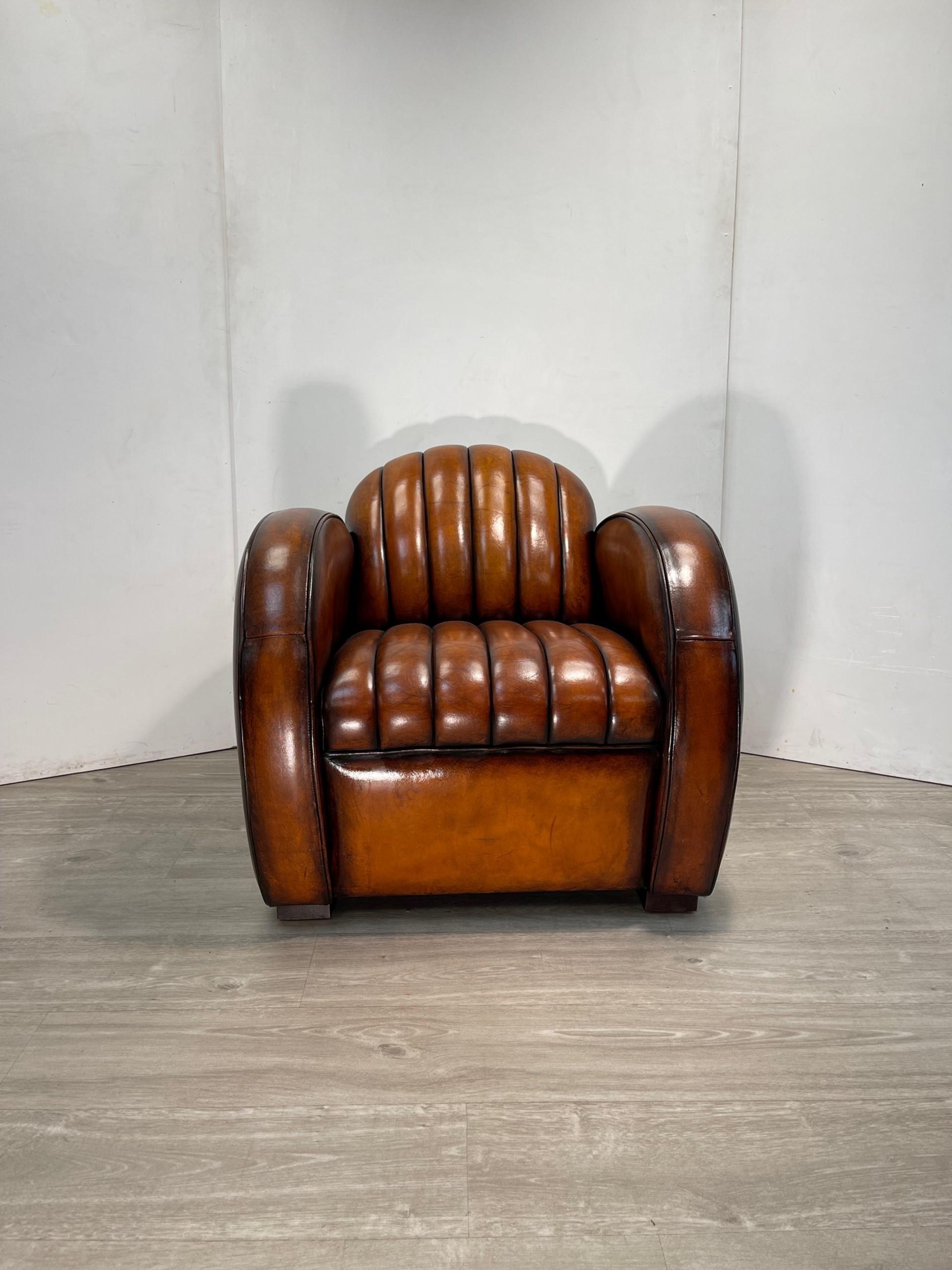 We are delighted to offer for sale this absolutely stunning fully restored hand dyed cigar brown leather, Art Deco style armchair based on the 1966 Mustang Fastback

What a chair! This is the only one in the world with this exact colour finish, it