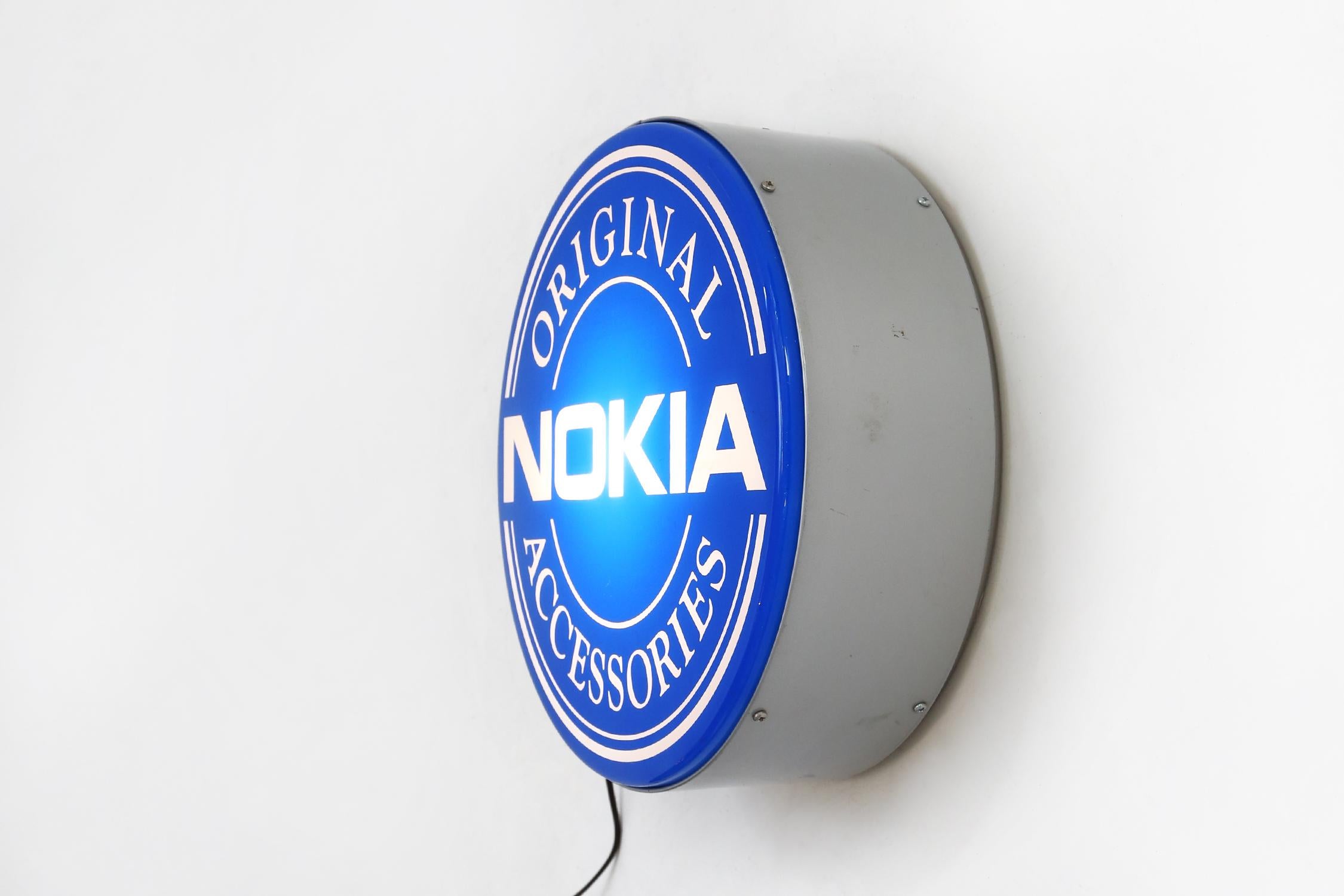 Finland / 1995 / Nokia Advertising light sign / plastic / Postmodern / Vintage

Rare wall-mounted advertising sign featuring the iconic Nokia logo, a symbol of innovation and reliability in the telecommunications industry.

The bold design and
