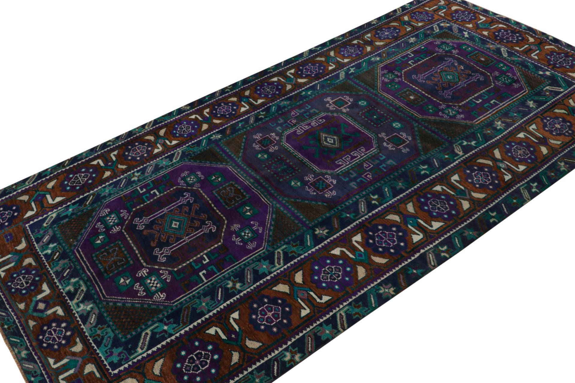 Hand Knotted in wool, this rare vintage 5x9 Oushak runner rug from the rare series of mid-century runners, features saturated teal tones which underscore vibrant purple, blue and brown with rust accents in the geometric patterns. 

On the Design: