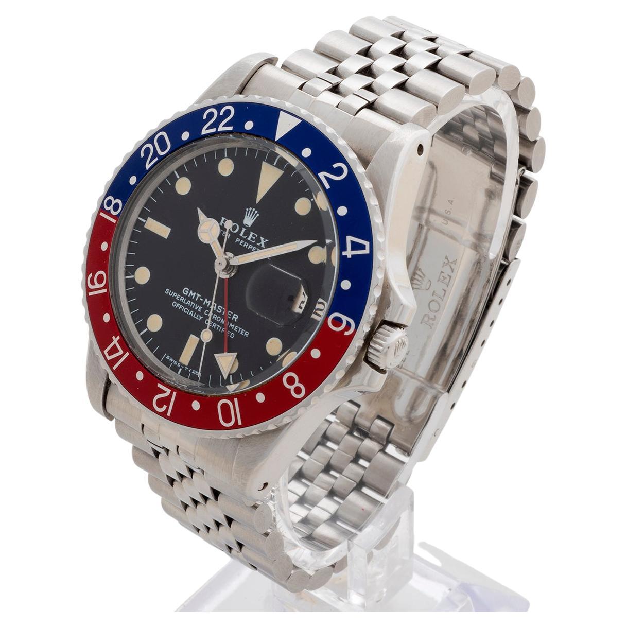 Our rare vintage Rolex GMT Master, reference 1675 , is presented in excellent condition for its age. Featuring a classic combination of pepsi blue and red bezel, stainless steel case and stainless steel jubilee bracelet. The original matching hands