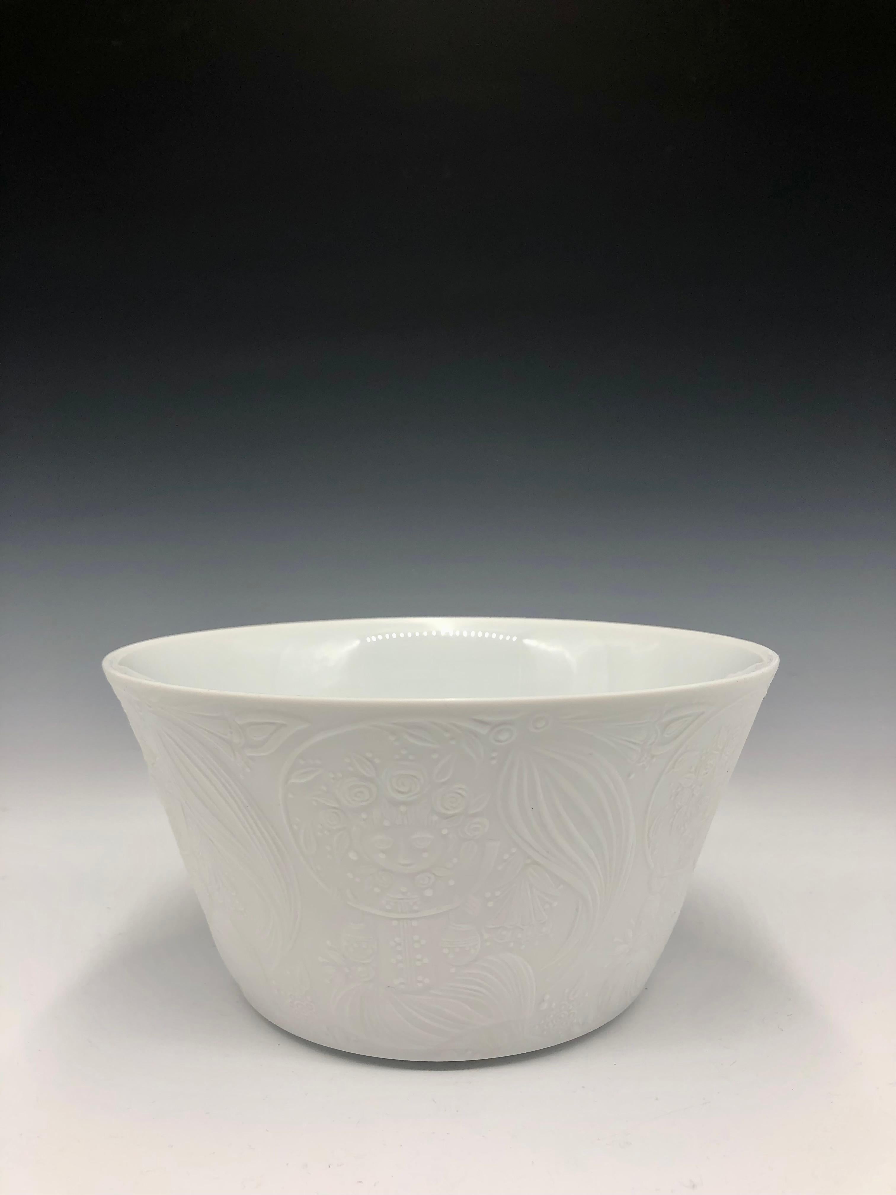 A beautiful white matte porcelain bisque bowl with figurative exterior relief and a plain white glossy interior from the 1960s by Danish designer Bjorn Wiinblad for Rosenthal Studio-Linie produced in Munich, Germany,  

Markings include the original
