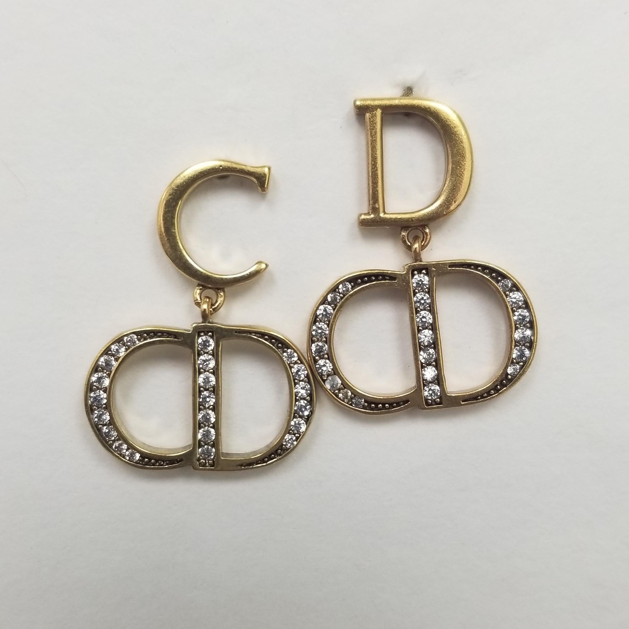The listing is for a rare vintage runway Christian Dior necklace and matching rhinestones earrings. the necklace consist of a gold metal link and smaller link adjustable to 15.5 inches. necklace is normal wear for the period. the earrings have the
