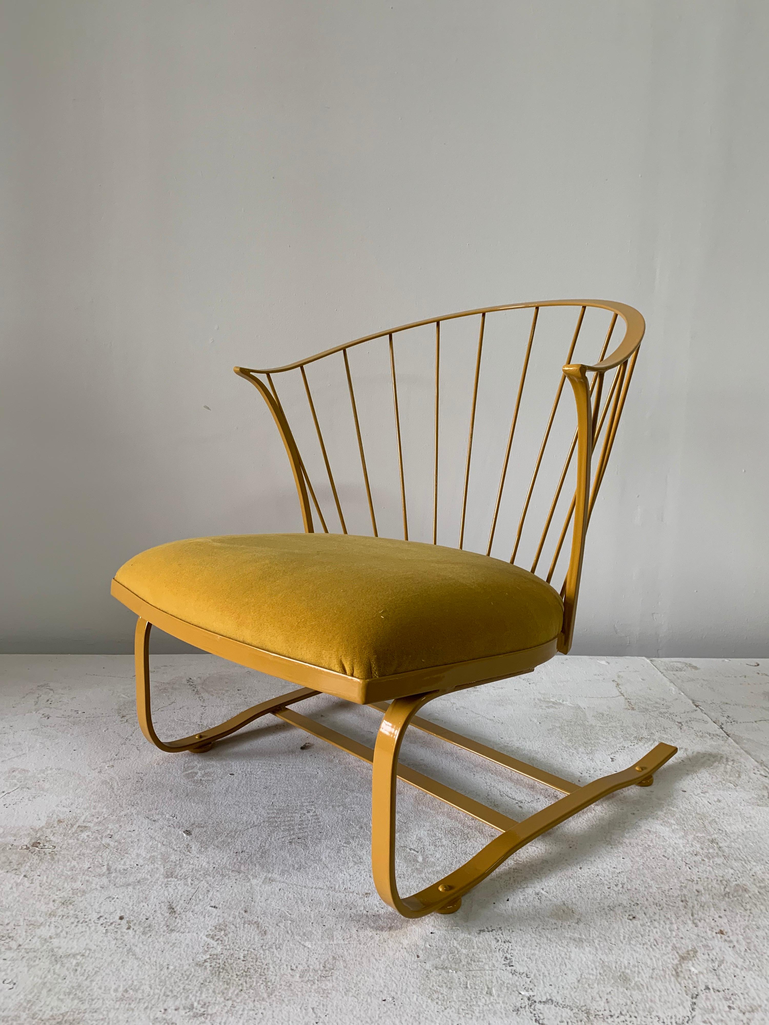 Rare vintage Russell Woodard custom powder-coated chair that leans back in rocker style. This newly powder-coated iron Woodard chair in “Cat yellow” and finely upholstered in matching cotton/mohair fabric. This has been upholstered for interior use.