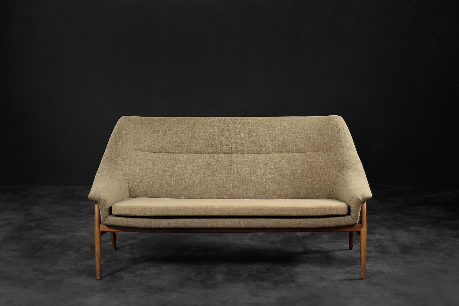 This rare two-seater Grace sofa was produced by the Swedish company IKEA in 1961. The softly rounded shape of the frame, where the backrest smoothly turns into armrests, due it lightness and exceptionally. Filling with elastic foam affects the