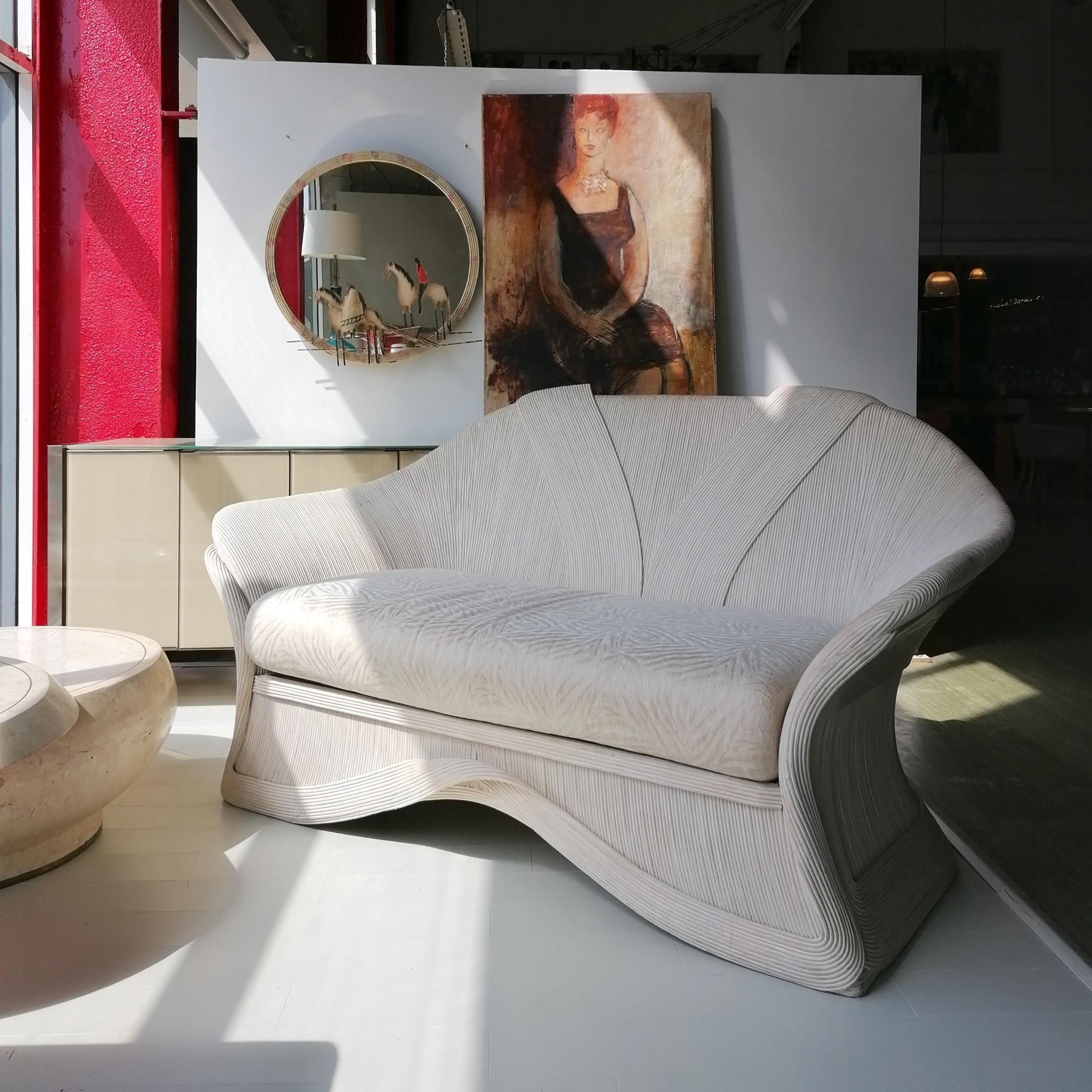 A rare sculptural pencil reed & wood sofa by Betty Cobonpue, USA 1980s.
From her 'Scultura' range. There's not a bad angle on this beauty.

Seat cushion has its original self-patterned cream fabric- a mark on the underside of this, but otherwise