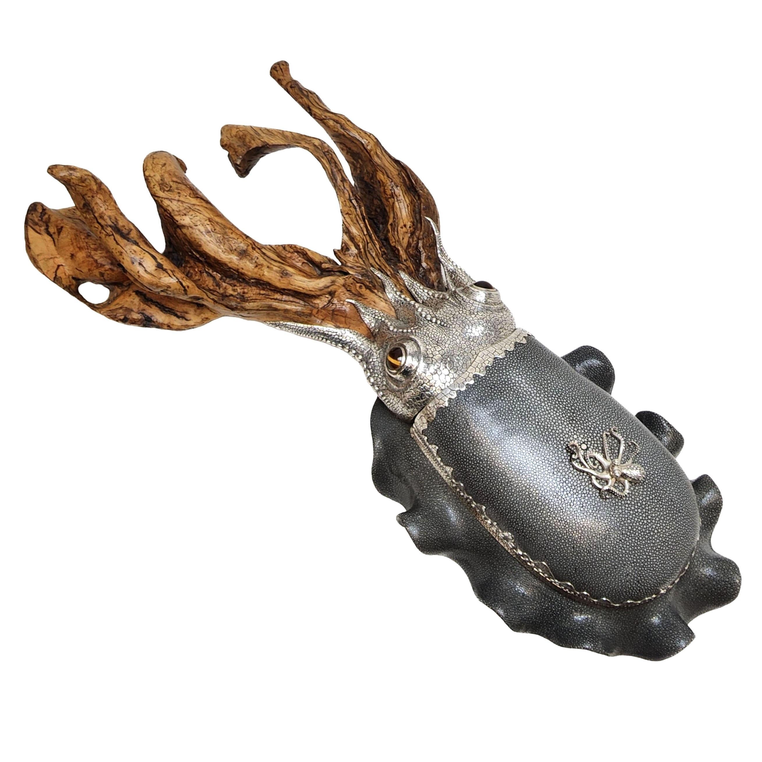 A magnificent and unique Cuttlefish Sculptural Centrepiece made from Silver, Shagreen and Wood. The Cuttlefish has a green shagreen body mounted wish a silver head and embellished with a silver band around the body. The Shagreen Body features a