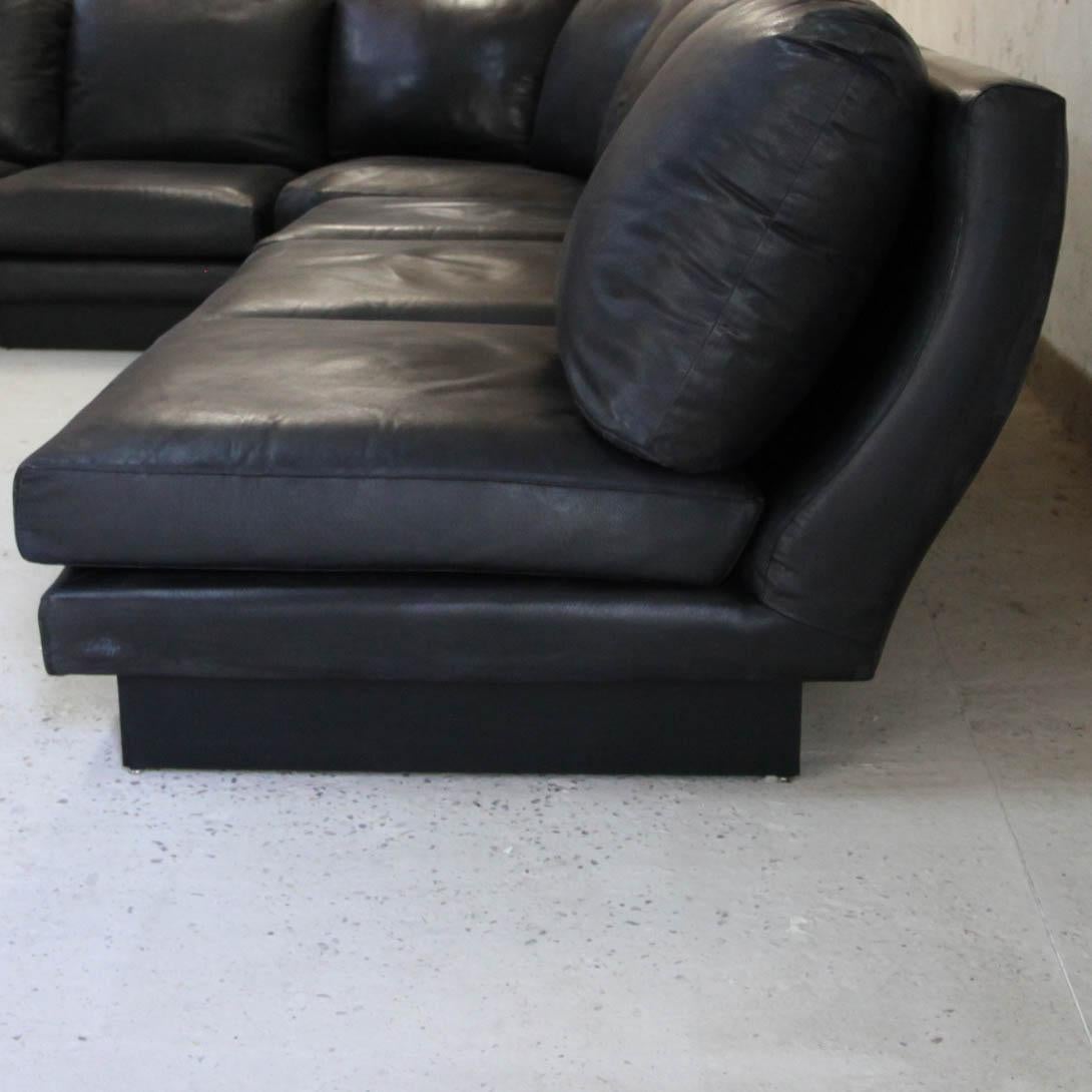 Rare vintage sofa in black leather and laminate composed of 5 low chairs and a corner module, all signed Willy Rizzo.