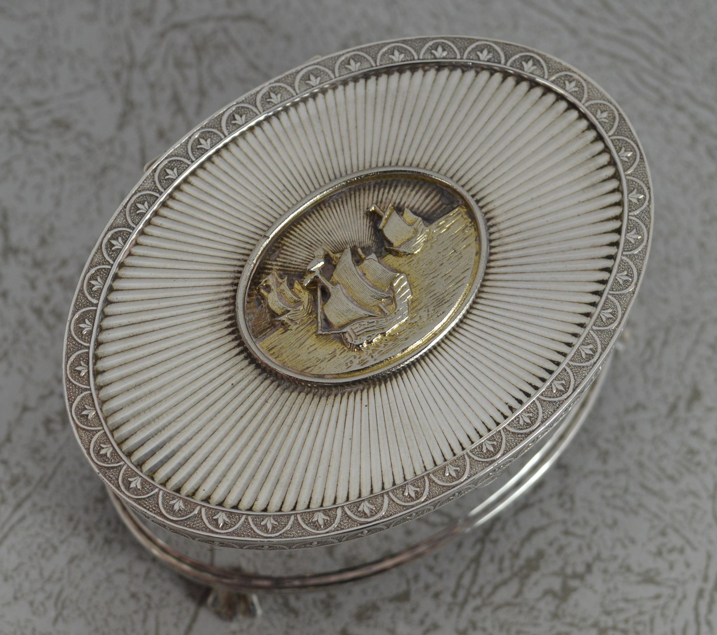 A highly attractive and rare sterling silver music box.
English made piece, 1979. 
Limited edition of just 500.
Solid example. Oval shape with a three ship design to centre of lid.
Winder to base to play musical tune.

Hallmarks ; to inside
Weight ;