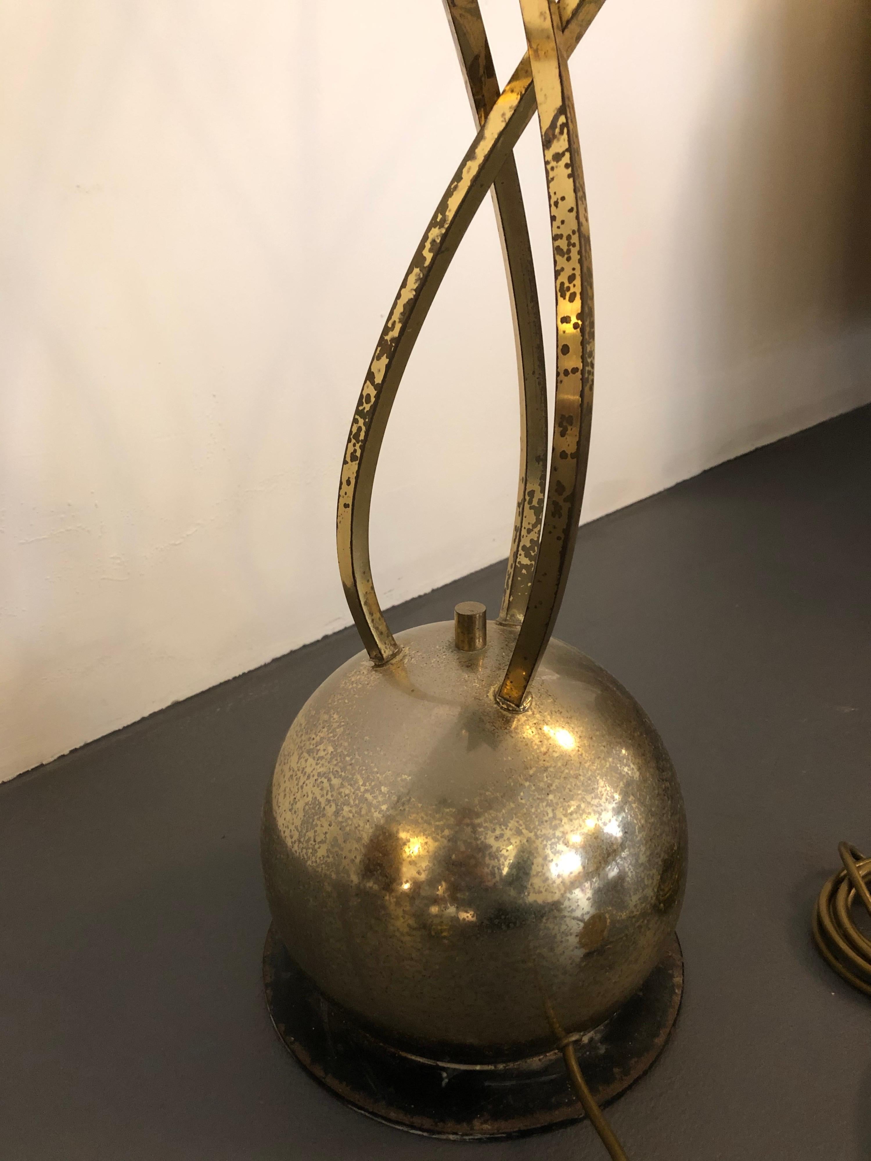 Rare floor lamp designed and produced by the Italian designer Tommaso Barbi during the 1970s. It has been left in original vintage condition with patina and spots on the brass.