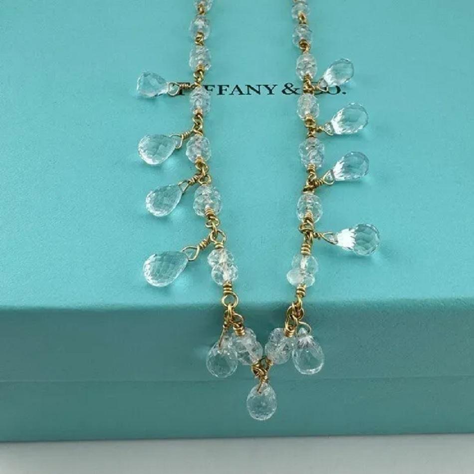 Rare Tiffany& Co aquamarine briolette gemstone necklace. The  necklace is 16'' long made of  18K yellow gold, and weight 12.8gr, It also has 11 briolette aquamarines, and 34 carved aquamarines. Condition New, never worn. Comes with Tiffany& Co Pouch.