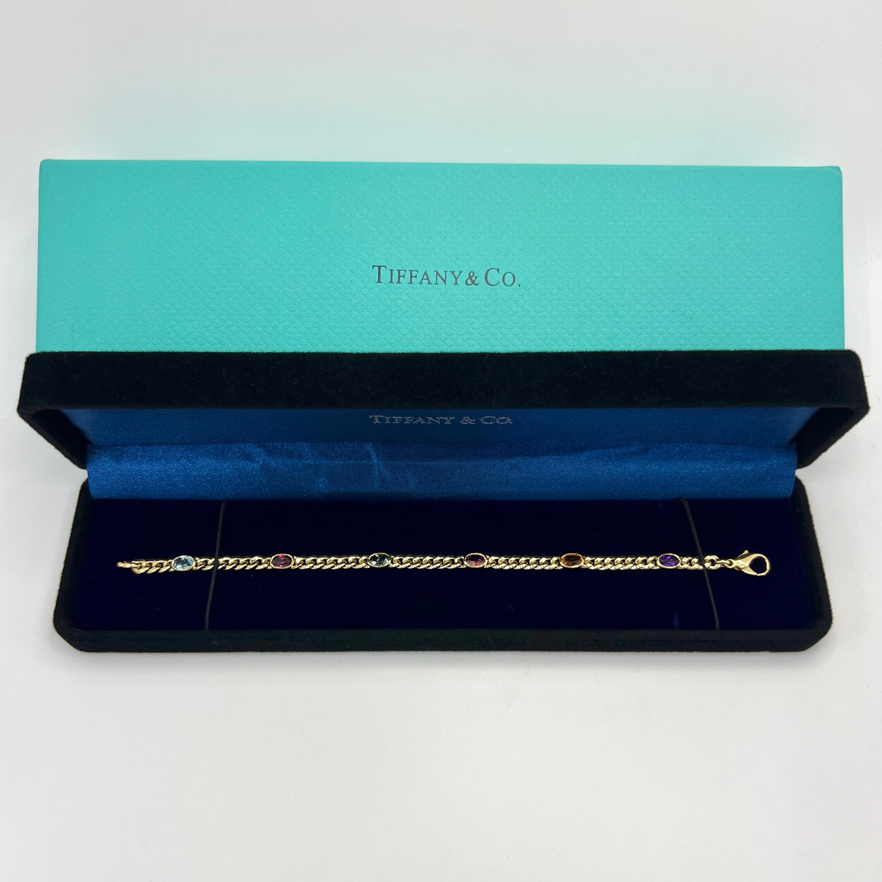 Rare Vintage Tiffany & Co Multi Colour Gemstone 18k Yellow Gold Curb Bracelet.

Fine vintage bracelet from Tiffany & Co. featuring a selection of natural oval cut gemstones of different colours.
This bracelet features six natural gemstones of the