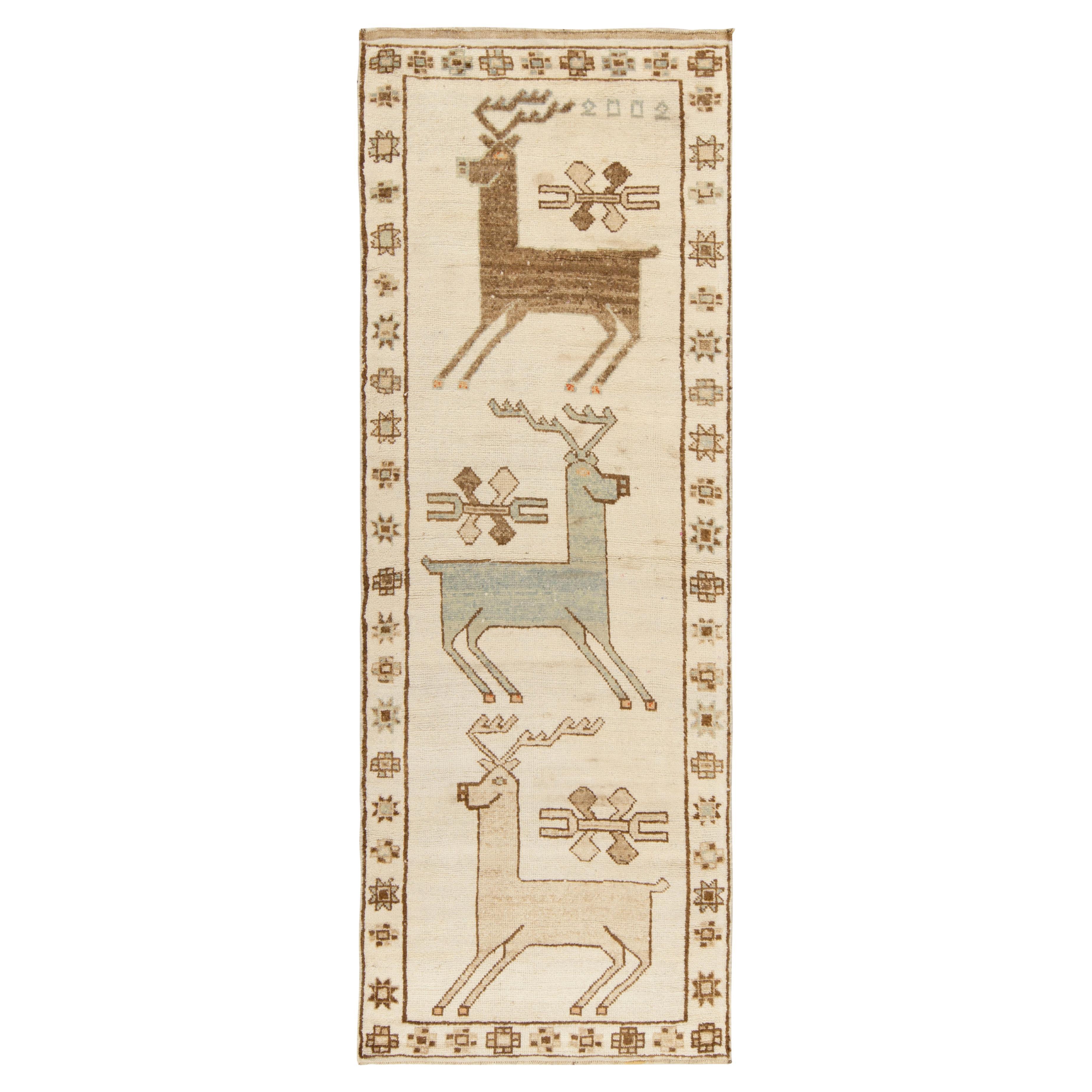 Seltener Vintage-Stammesteppich mit beige-braunen Hirsch-Bildermustern von Teppich & Kelim