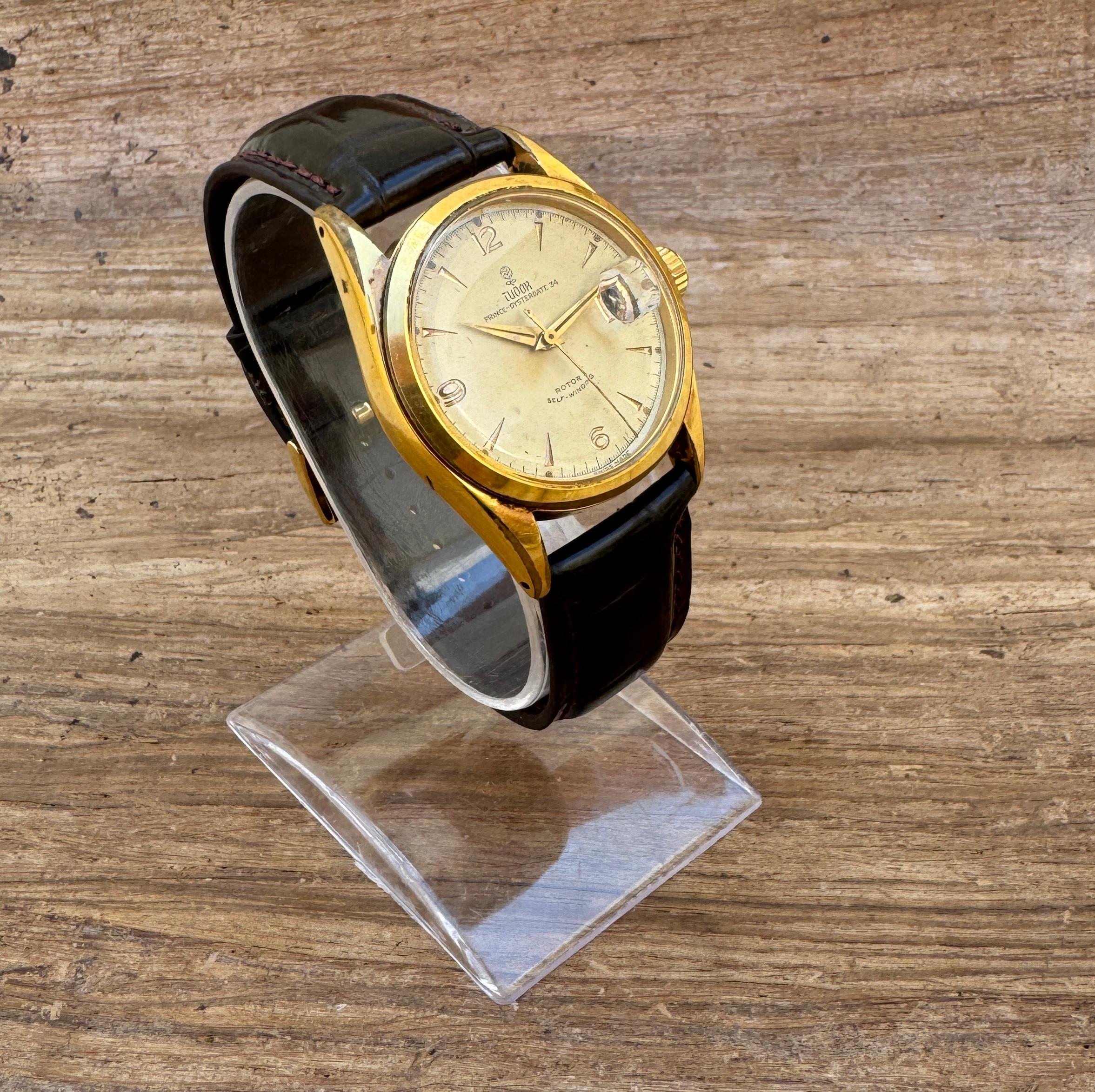 Brand: Tudor

Model: Prince Oysterdate 34

Reference Number: 7914

Country Of Manufacture: Switzerland

Movement: Automatic

Case Material: Gold Capped

Measurements : Case width: 34 mm. (without crown)

Band Type : After Market Hand Made