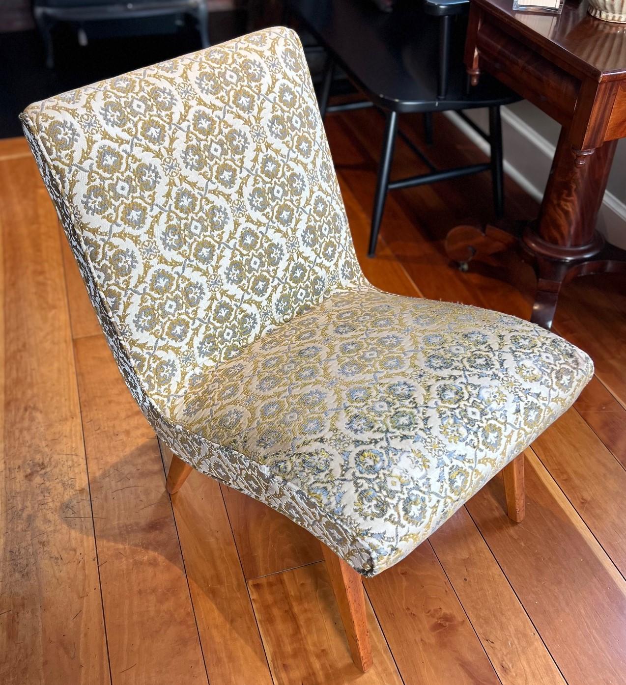A 1940s Jens Risom for Knoll Associates Inc. Vostra Easy chair upholstered in a cream, golden and blue damask fabric. Unconventional and memorable, it was the epitome of a new departure in high design, and remains an example of the timeless quality