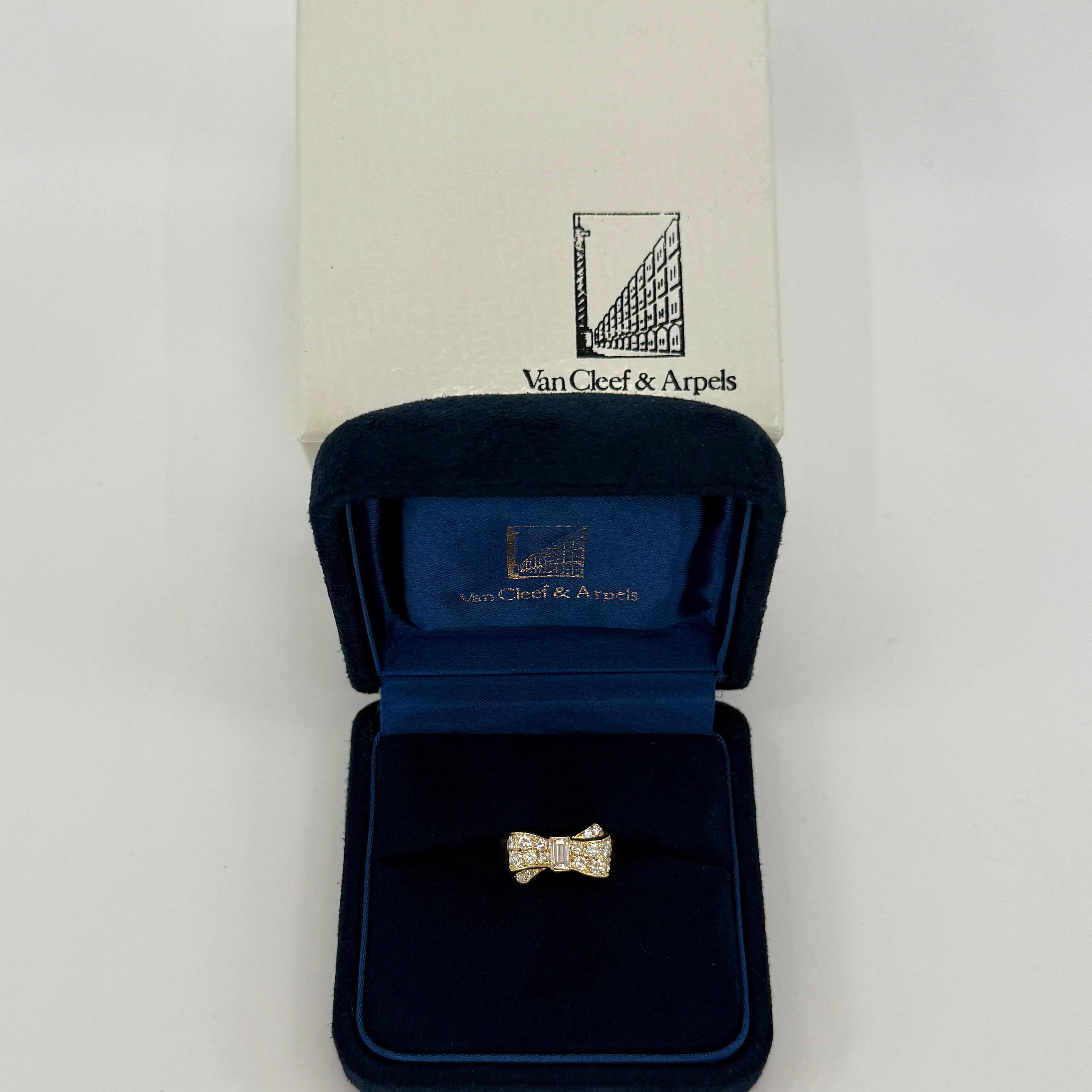 Rare Vintage Van Cleef & Arpels Diamond 18k Yellow Gold Ribbon Bow Ring.

A stunning ring with a unique design typical of Van Cleef & Arpels, set with a beautiful arrangement of top quality white diamonds. Featuring a 5x2.6mm baguette and varying