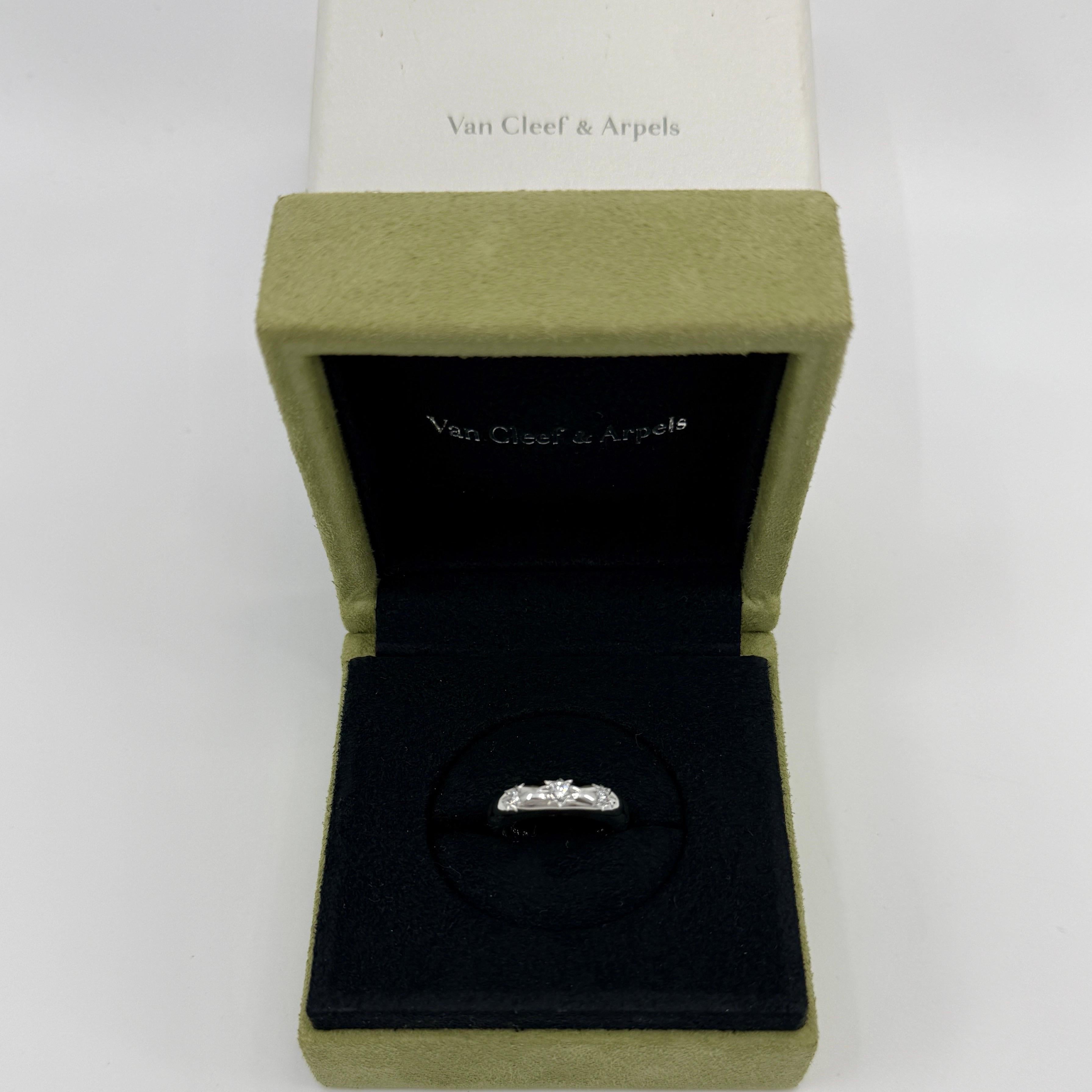 Vintage Van Cleef & Arpels Star Set Round Cut Diamond Three Stone 18k White Gold Ring.

A stunning vintage ring with a classic three stone design. Set with three fine natural round cut diamonds, with 2.6mm centre stone stone and 2.2mm accents. 
Top