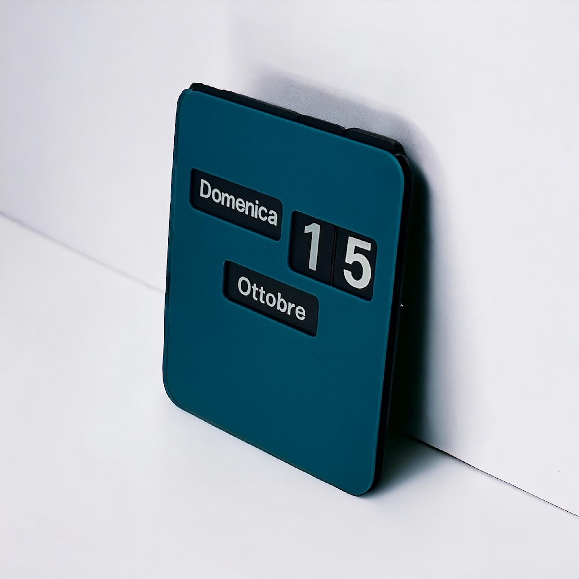 Dive into the retro-futuristic charm of the 1970s with this unique calendar, meticulously crafted in Italy. Unlike traditional calendars, this square gem features movable plastic panels that allow you to effortlessly adjust the date, adding an