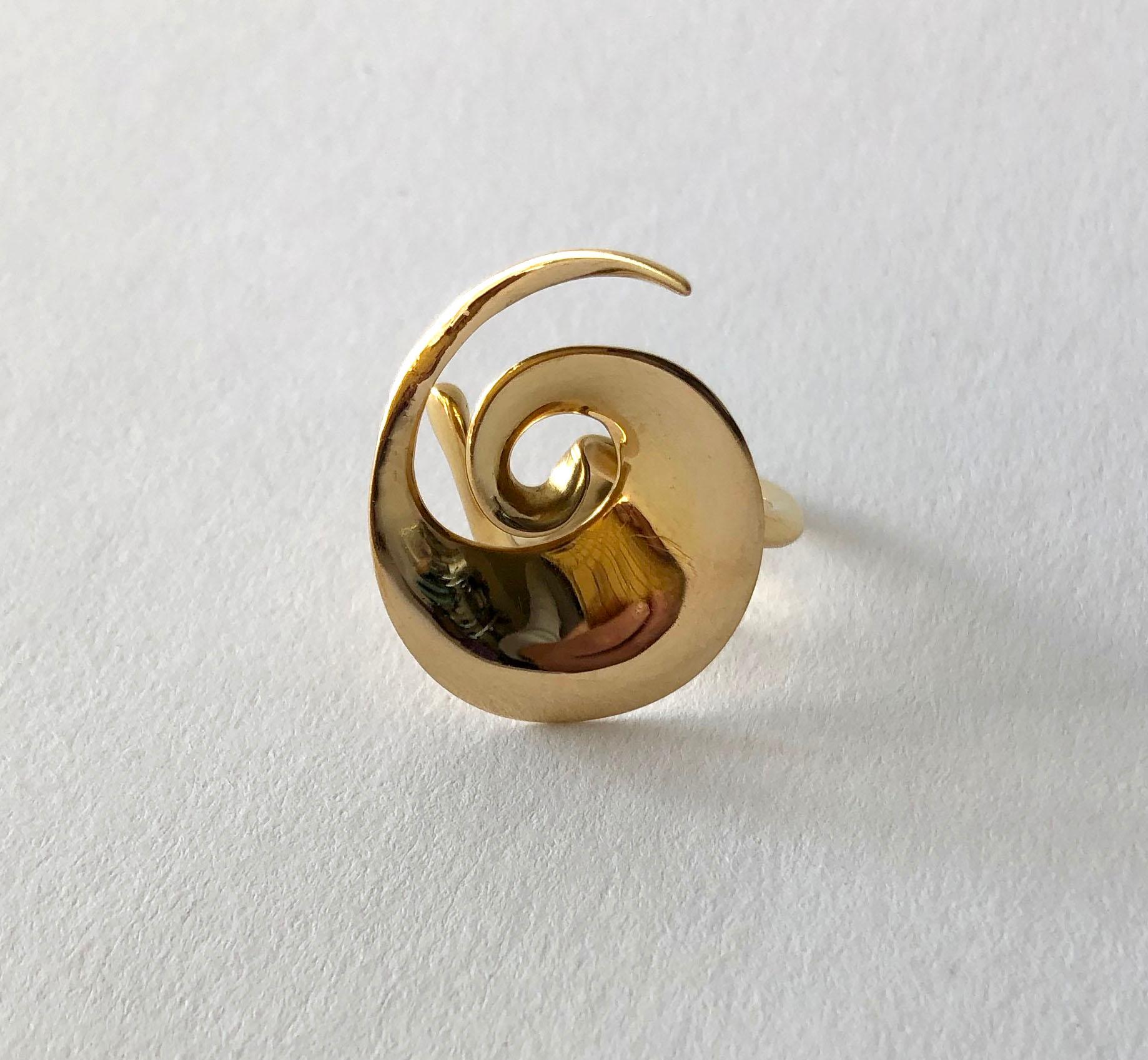 A rare, 18 karat gold spiral ring by Vivianna Torun Bülow-Hübe for Georg Jensen, circa 1950's. Ring is a finger size 6 to 6.5 due to its unusual design.  Signed Torun, George Jensen, 750, Denmark.  In very good vintage condition. 7.5 grams.