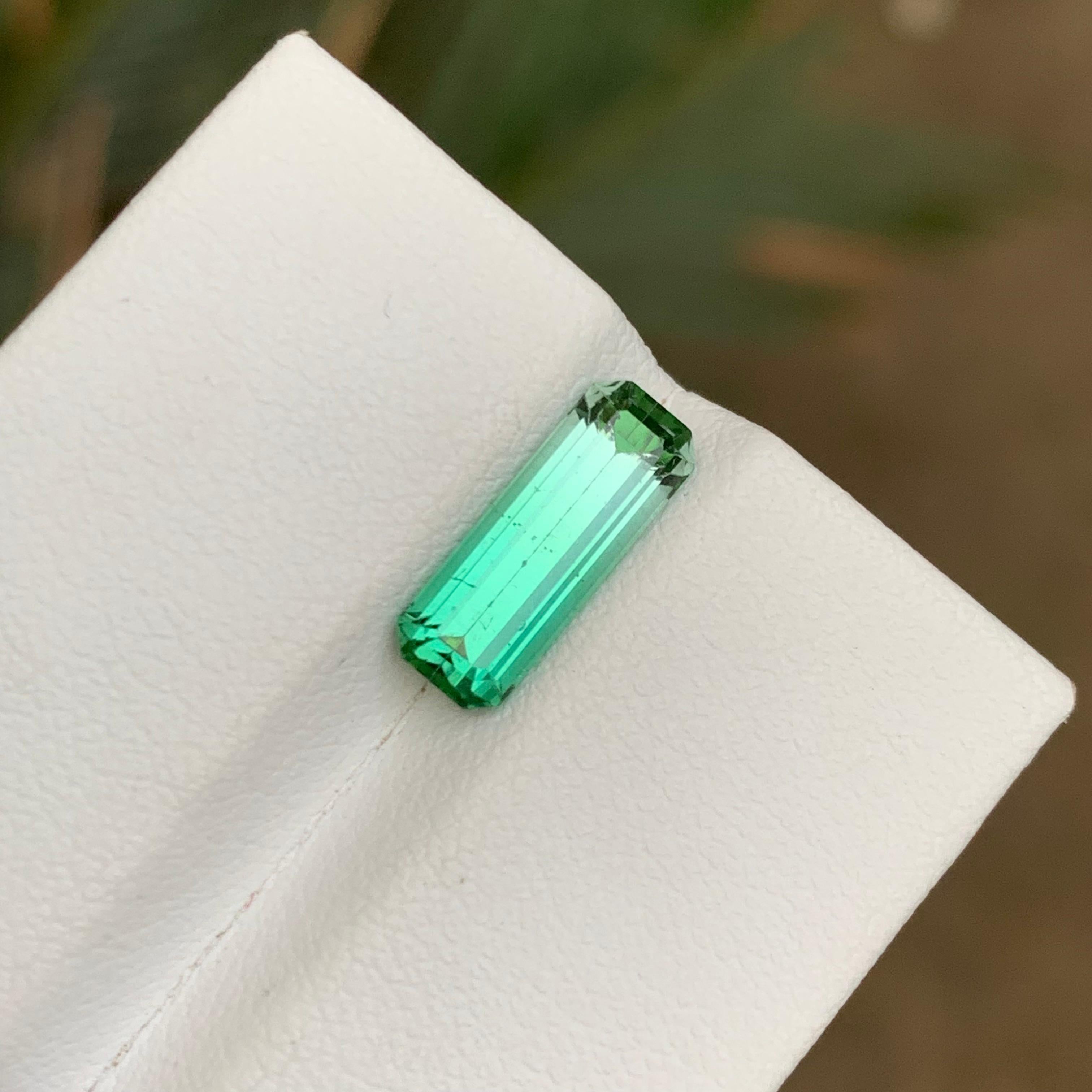 GEMSTONE TYPE: Tourmaline
PIECE(S): 1
WEIGHT: 2.25 Carats
SHAPE: Emerald
SIZE (MM): 12.52 x 4.61 x 4.34
COLOR: Vivid Bluish Green Bicolor
CLARITY: Slightly Included 
TREATMENT: None
ORIGIN: Afghanistan
CERTIFICATE: On demand

Indulge in the allure