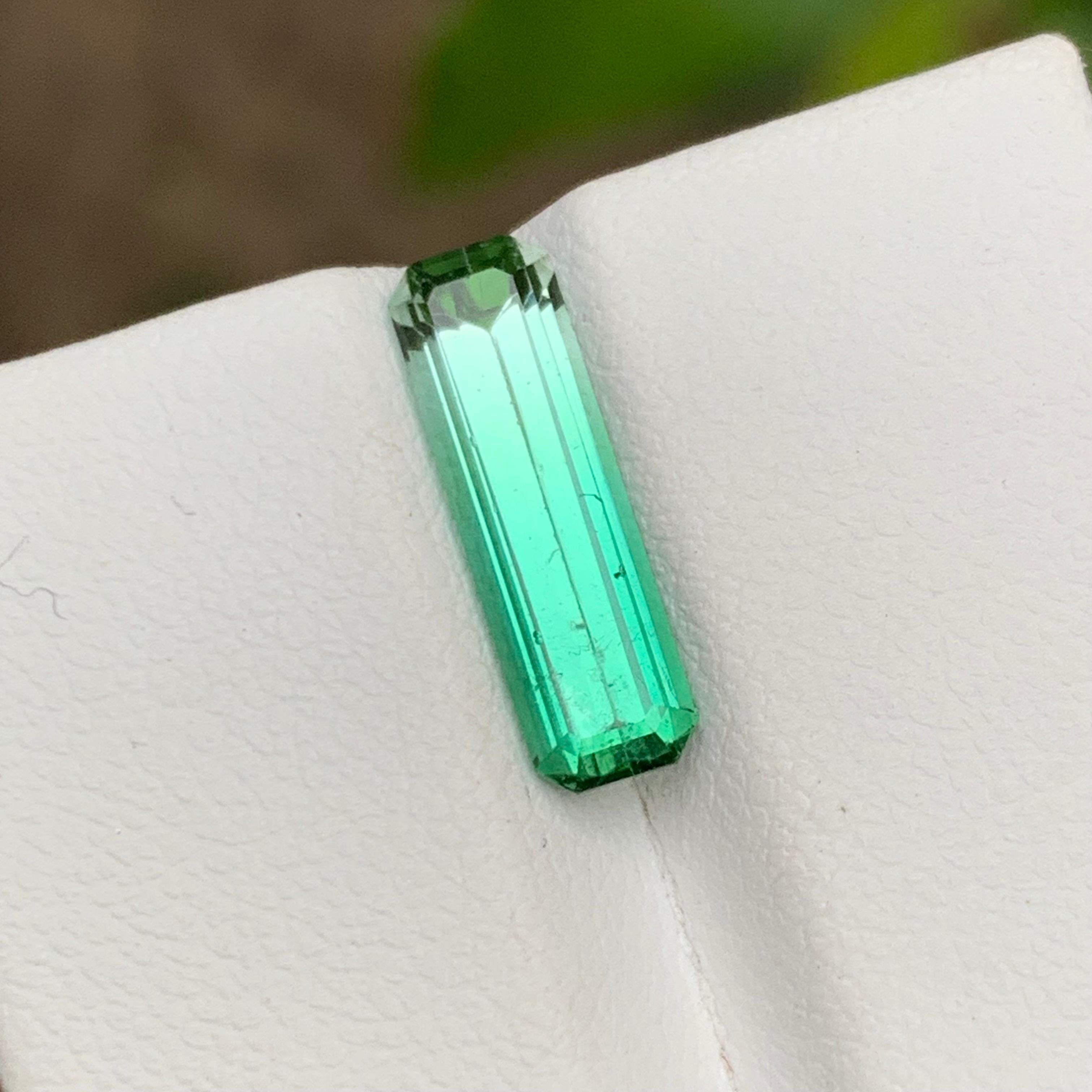 GEMSTONE TYPE: Tourmaline
PIECE(S): 1
WEIGHT: 2.85 Carats
SHAPE: Emerald
SIZE (MM): 15.49 x 4.67 x 4.23
COLOR: Vivid Bluish Green Bicolor
CLARITY: Slightly Included 
TREATMENT: None
ORIGIN: Afghanistan
CERTIFICATE: On demand

Indulge in the allure