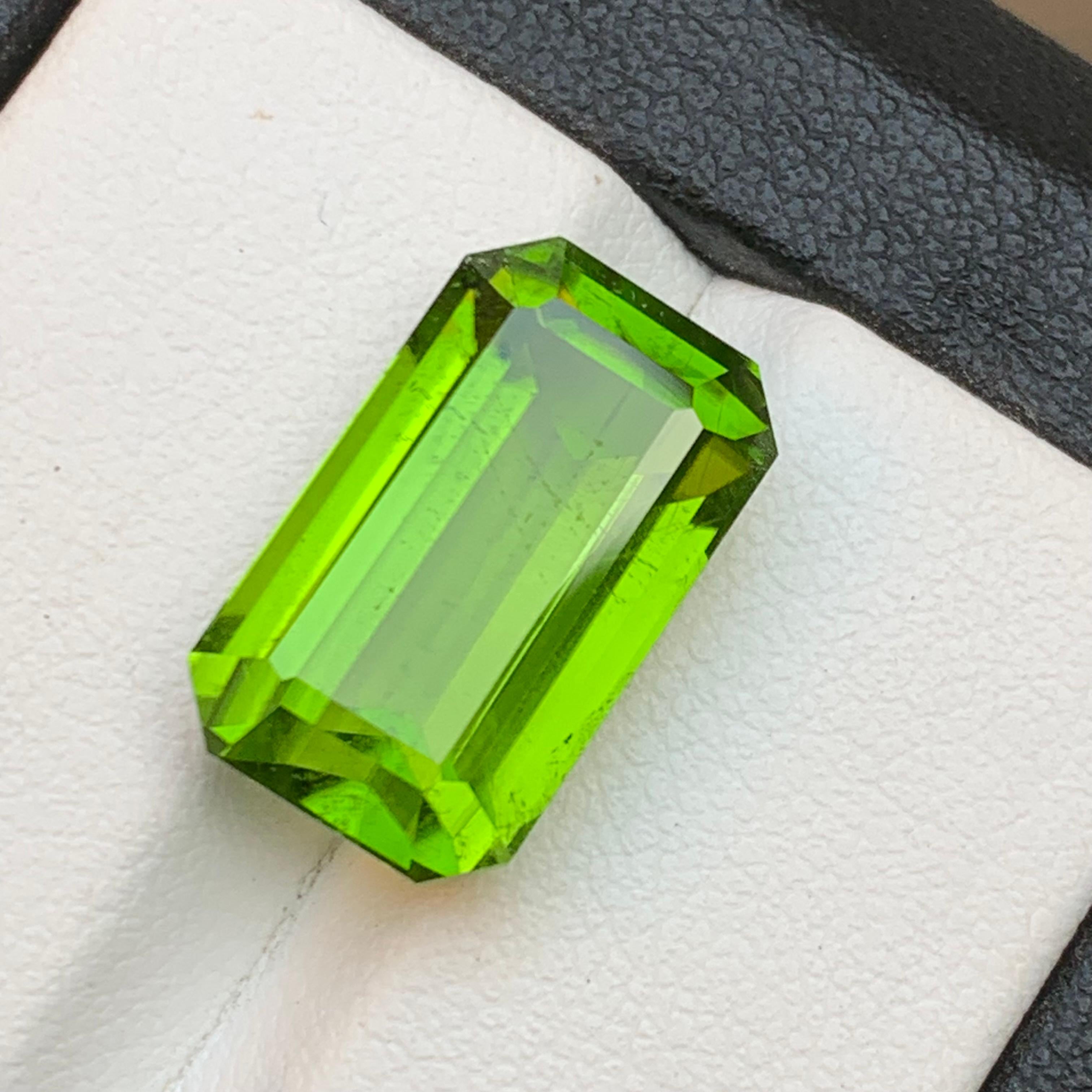 Contemporary Rare Vivid Green Natural Peridot Ring Pendant Loose Gemstone 12.80Ct Emerald Cut For Sale
