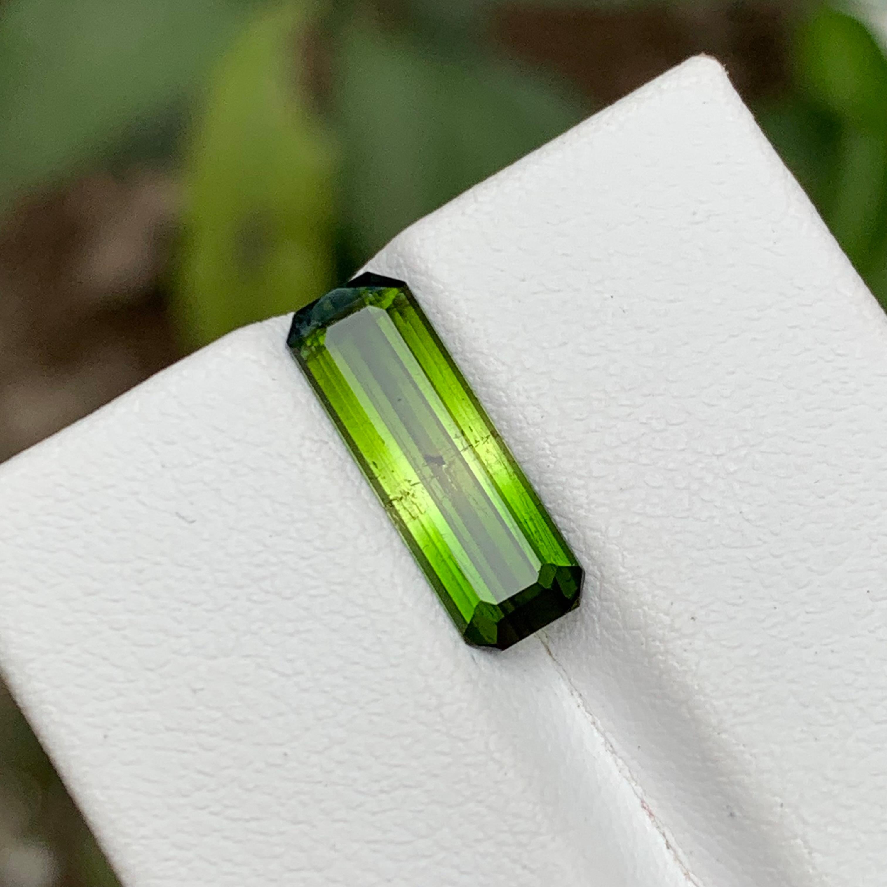 Truly exquisite 3.15 Carat Bicolor Natural Tourmaline Loose Gemstone, sourced directly from the mines of Kunar, Afghanistan. Crafted in a mesmerizing emerald cut design, this gemstone boasts a striking combination of vivid green and yellow hues,