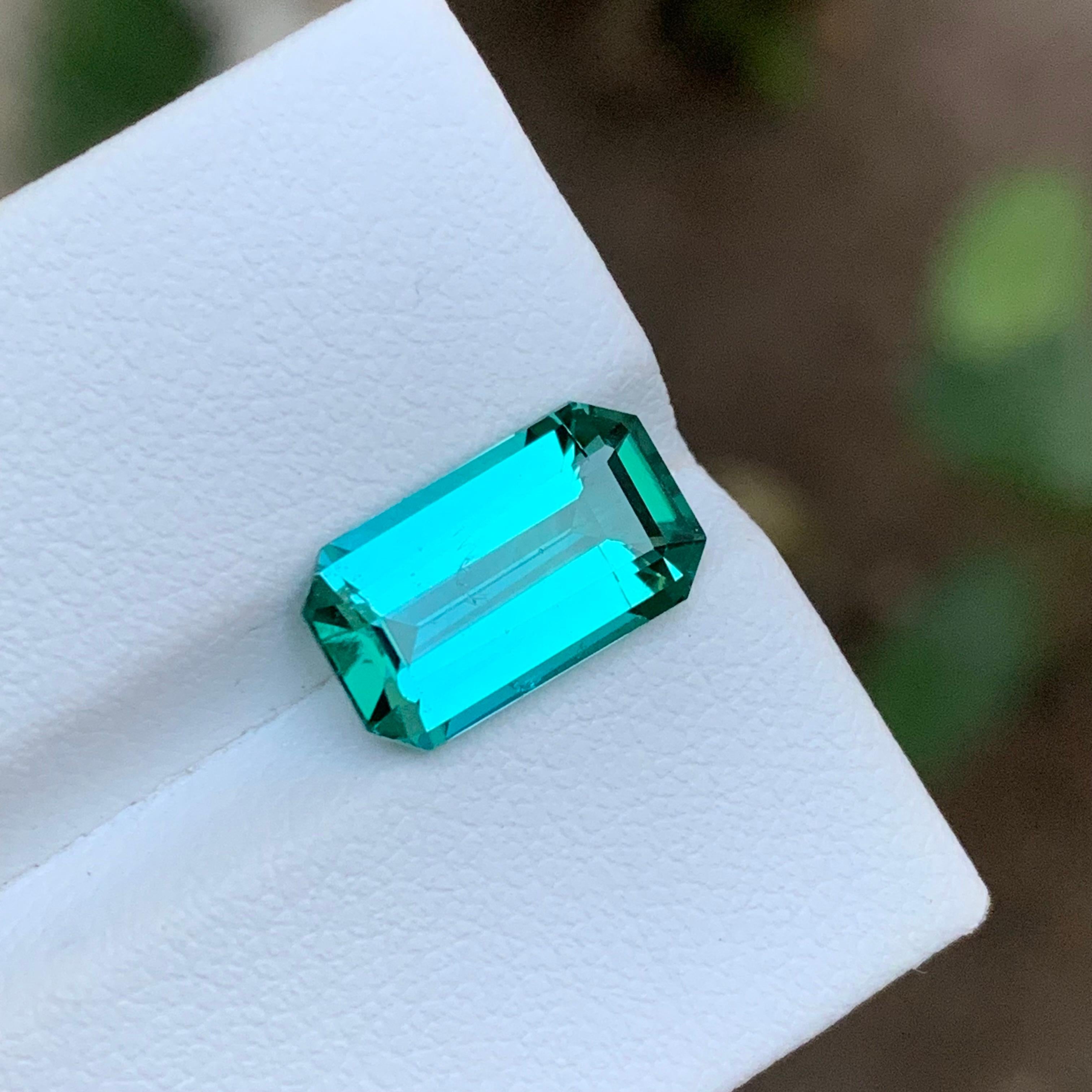 GEMSTONE TYPE: Tourmaline 
PIECE(S): 1
WEIGHT: 3.75 Carats
SHAPE: Emerald
SIZE (MM): 12.51 x 7.35 x 4.89
COLOR: Lagoon Neon Bluish Green
CLARITY: Approximately 98% Eye Clean
TREATMENT: None
ORIGIN: Kunar, Afghanistan 
CERTIFICATE: On demand
(if you