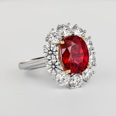 5.81 Carat Oval Cut Vivid Red Thai Siam Ruby & Diamond Halo 18K Ring