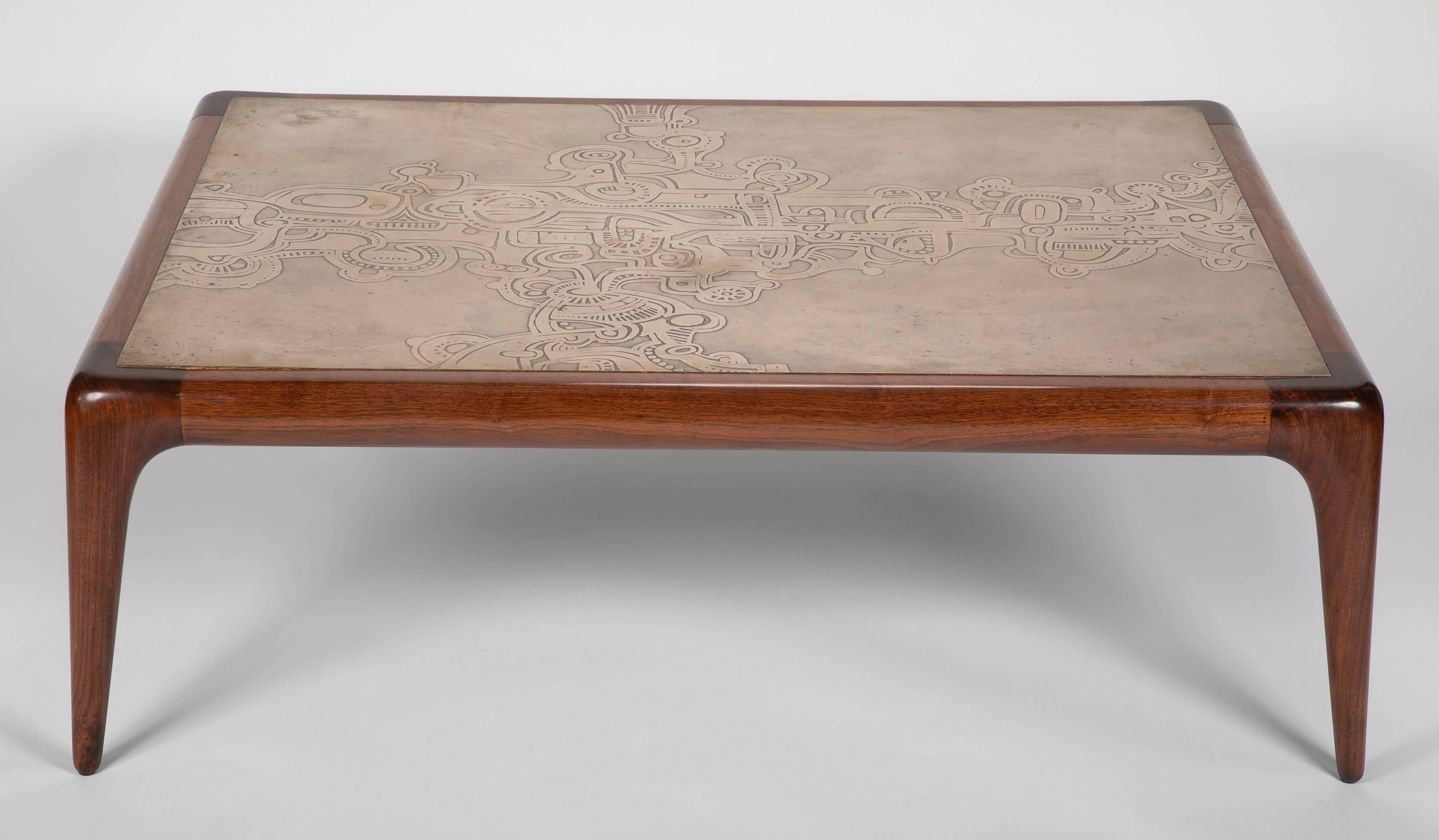 A Mahogany coffee table designed by Vladimir Kagan with unique bronze relief top. 

 Piasa, Paris, France, November 16, 2017, lot 7, catalogued as 'Piece unique'