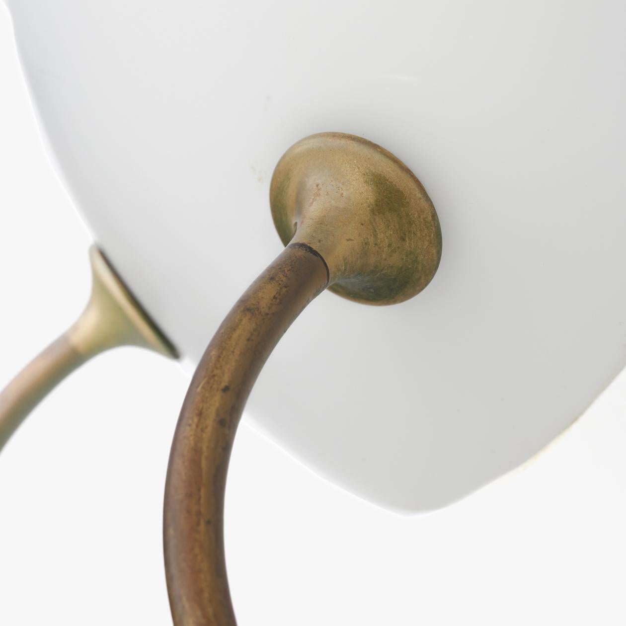 Wall lamp in patinated brass and opal glass. Designed for KFUM in the 1940s. Arne Jacobsen / Fog & Mørup.