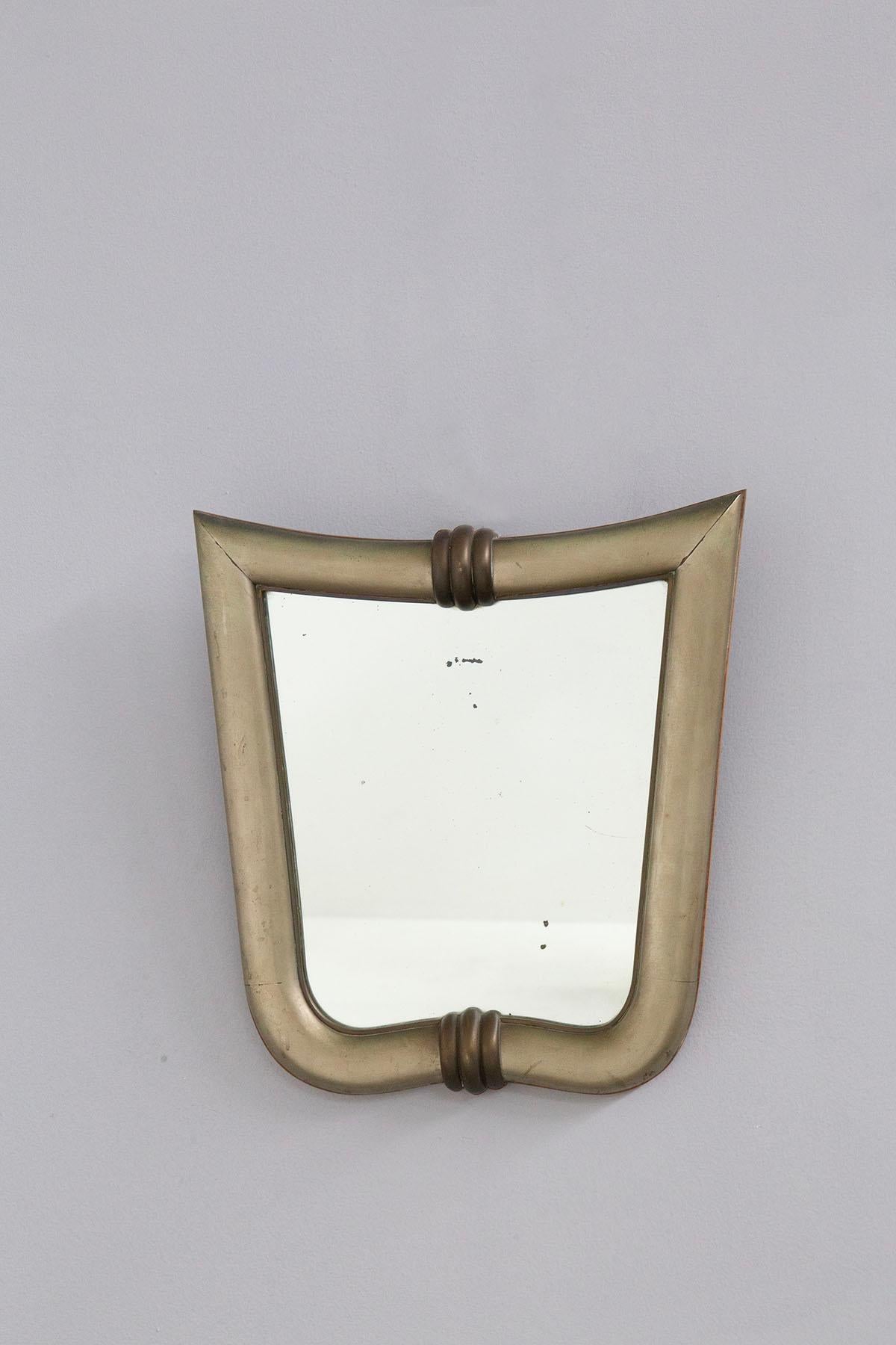 Very rare wall mirror attribuited the great Italian architect Gio Ponti, 1930s. Made with a wooden body i.e. with a wooden frame. The frame has been finished with silver leaf to give a shiny, metallic effect to the rare mirror. 
The mirror has
