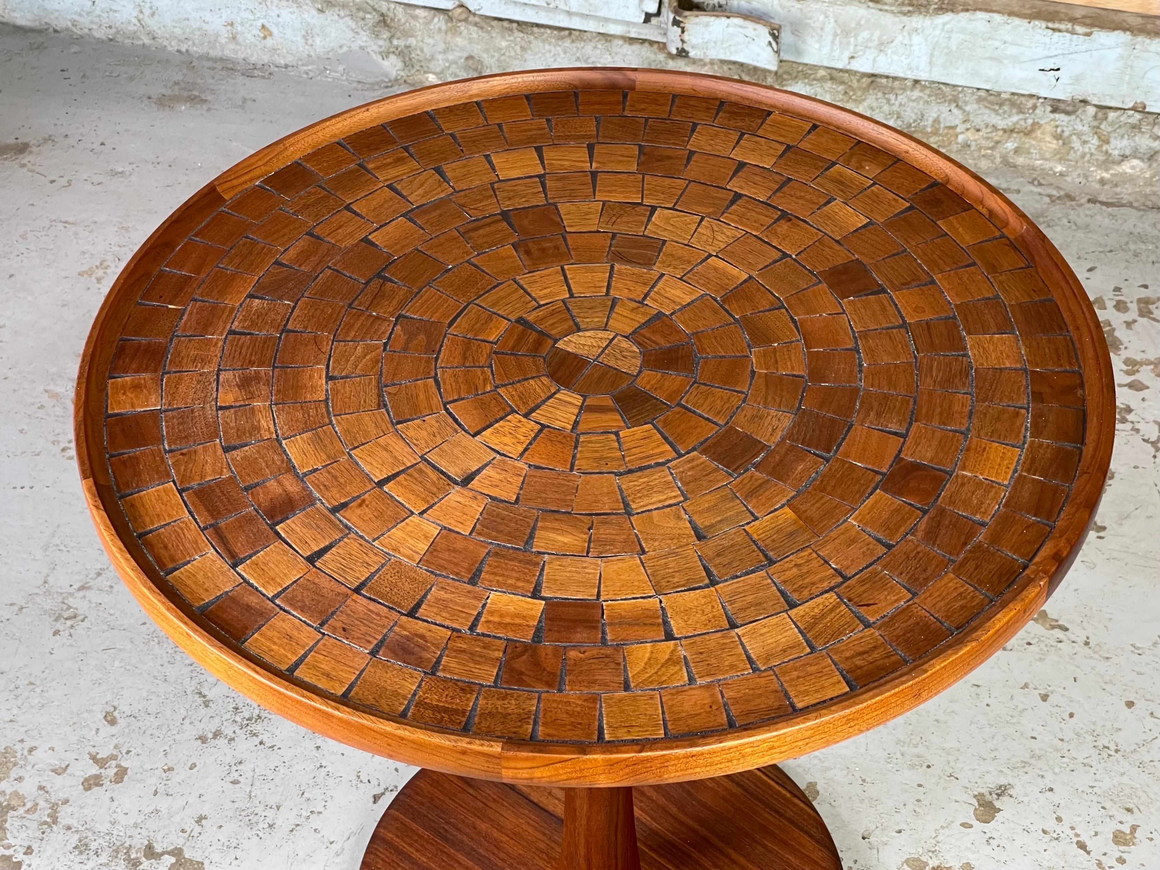 Rare & stunning walnut inlay pedestal table by Jane & gordon Martz for Marshall Studios. This is the first non-tile Martz table I have ever seen. The mosaic walnut cuts have such fantastic colors and grain - it's eye candy and functional. 
Excellent