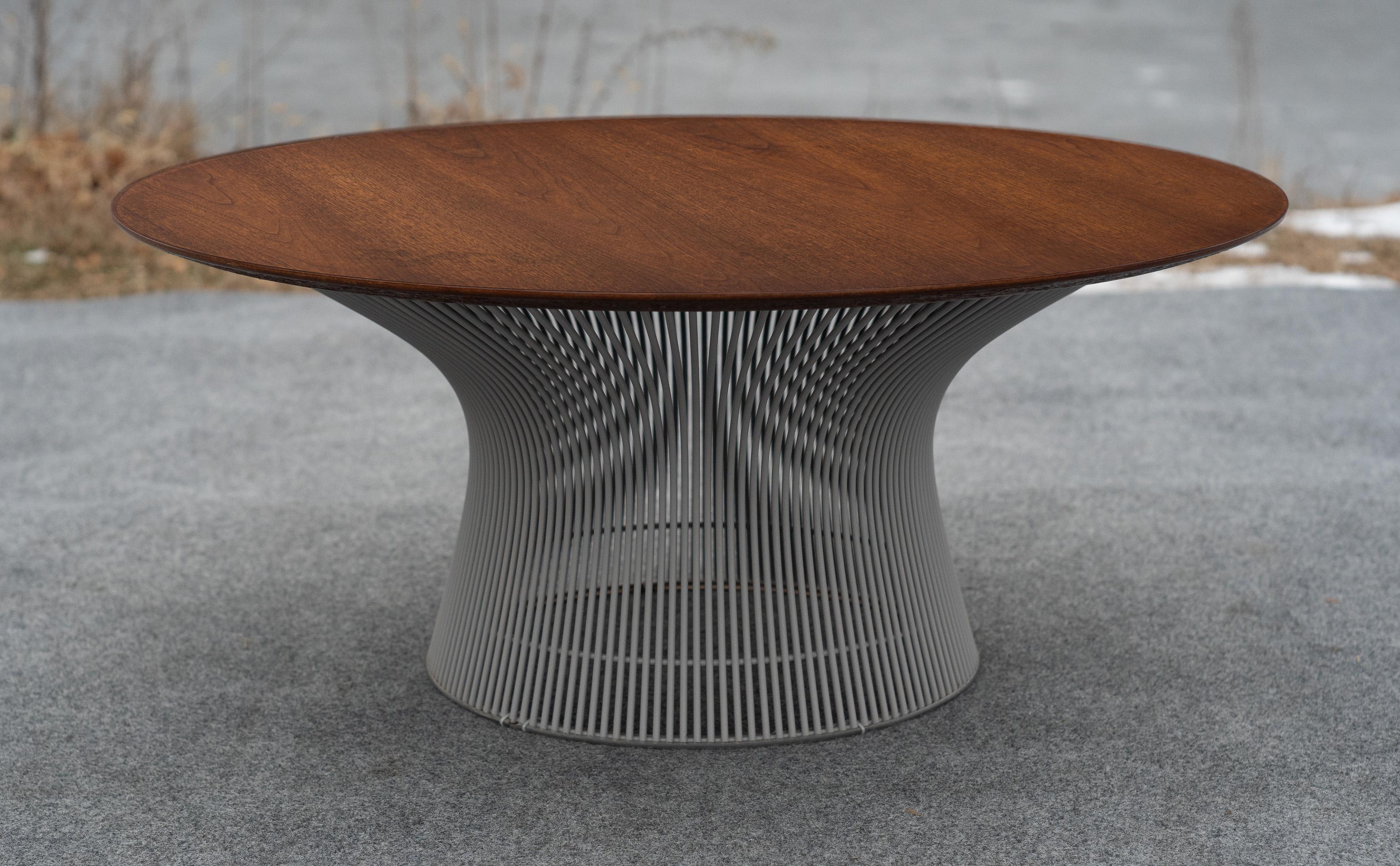 Designed by Warren Platner, this table was made in the US by Knoll. Dated by the label, we can determine the date of manufacture to be from the 1960s. This example is quite special, being ordered with a walnut top rather than a glass or marble top,