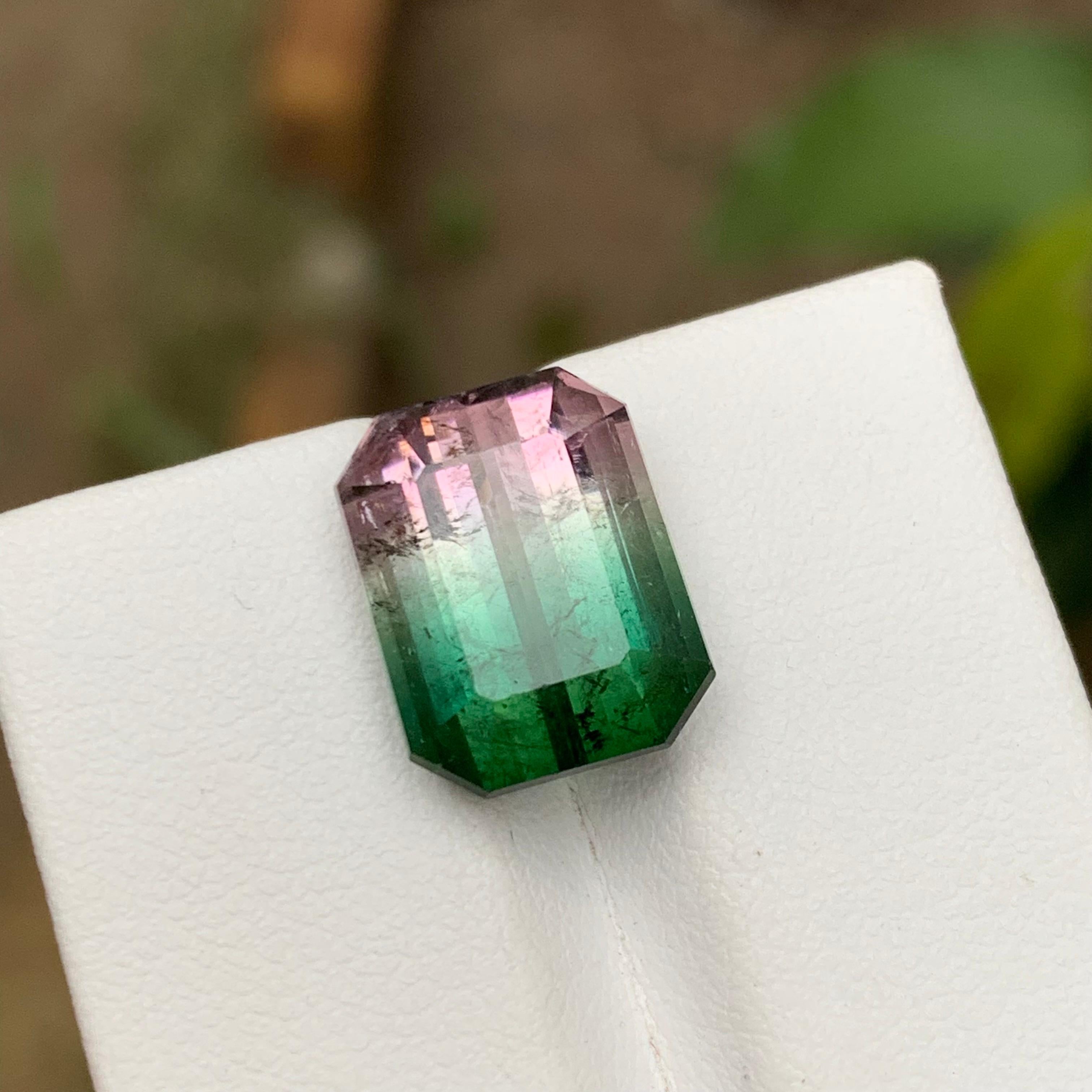 GEMSTONE TYPE: Tourmaline
PIECE(S): 1
WEIGHT: 10.15 Carat
SHAPE: Emerald Cut
SIZE (MM): 13.65 x 10.54 x 8.19
COLOR: Watermelon Bicolor Bluish Green & Pink
CLARITY: Slightly Included
TREATMENT: Heated
ORIGIN: Afghanistan
CERTIFICATE: On