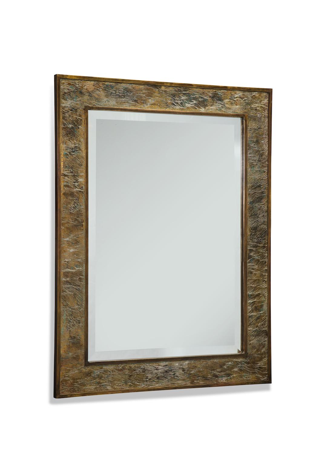 Fantastic rectangular mirror with bronze and pewter frame with incised lines depicting waves. A very rare model. Etched signature on lower face.