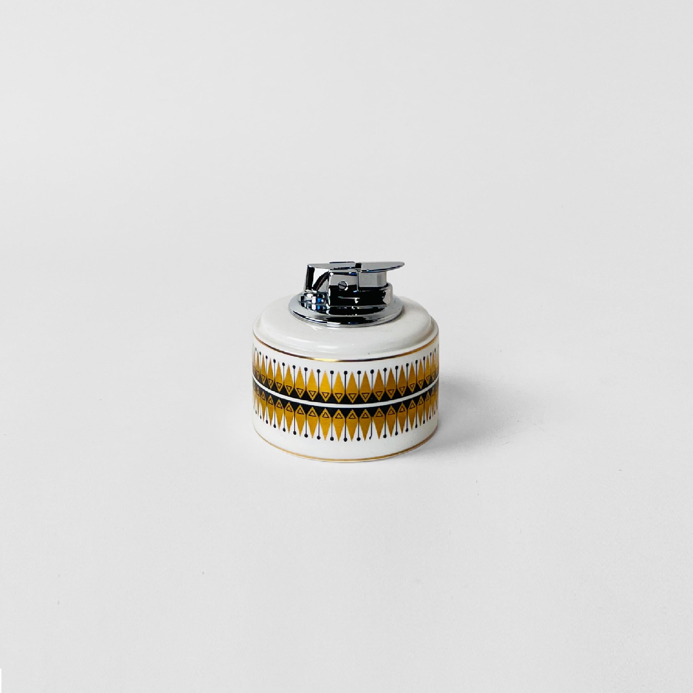 Rare porcelain Wedgwood table lighter. Shows a retro pattern in black and gold. Made in England, circa 1960.