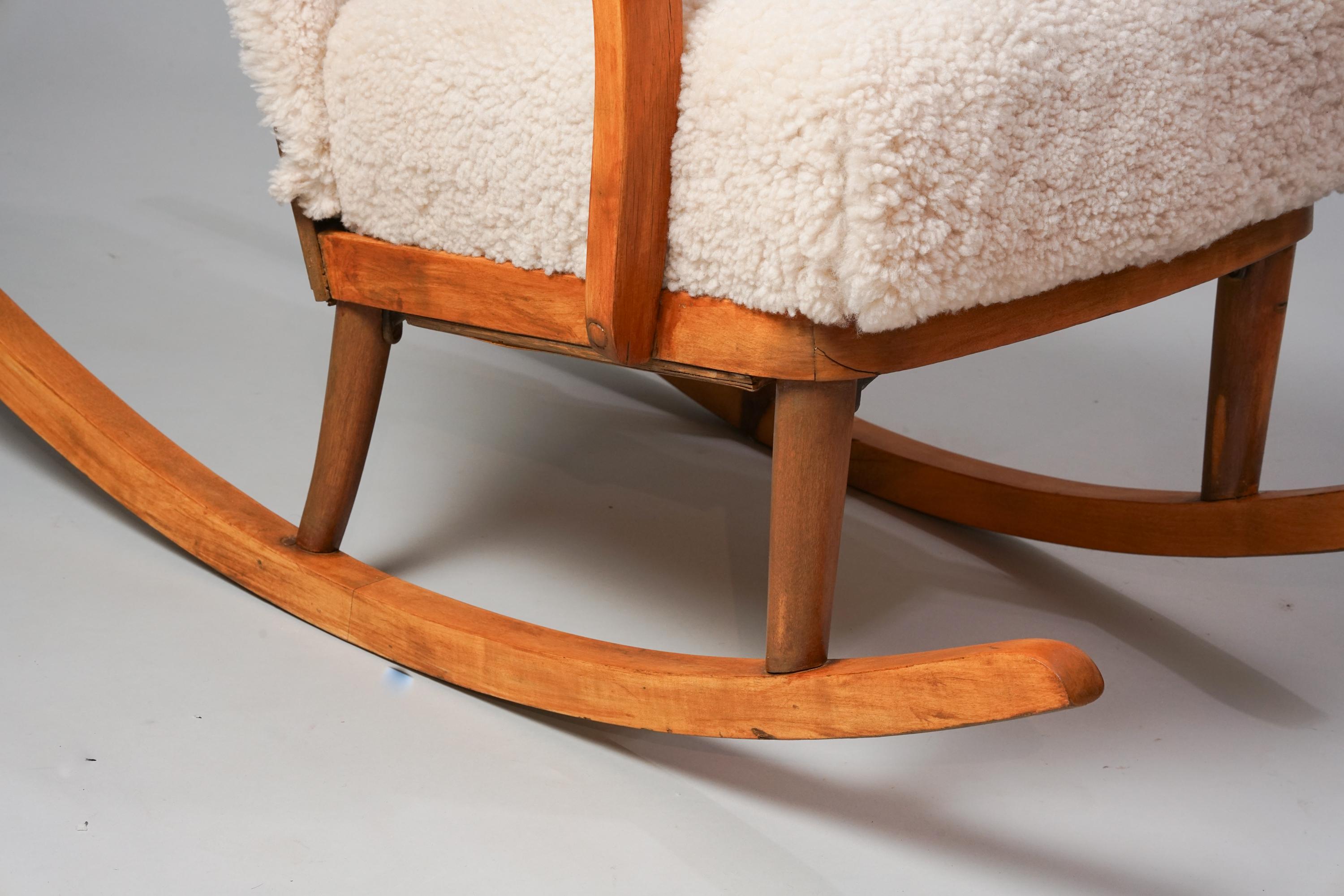 Rare Werner West rocking chair, 1930/1940s. Birch frame with sheepskin upholstery. Good vintage condition, minor patina consistent with age and use. Beautiful and classic Scandinavian Modern -style rocking chair. 
