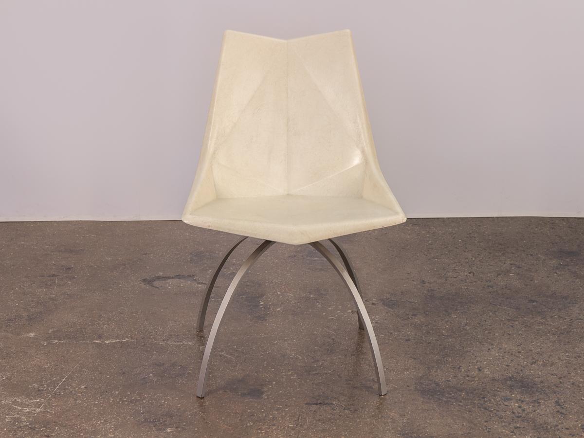 1960s vintage white molded fiberglass Origami shell chair designed by Paul McCobb on very scarce spider base. A stunning example of this rarely seen combo. The faceted chair has been lovingly used with minimal wear. Front corner has a slight chip,