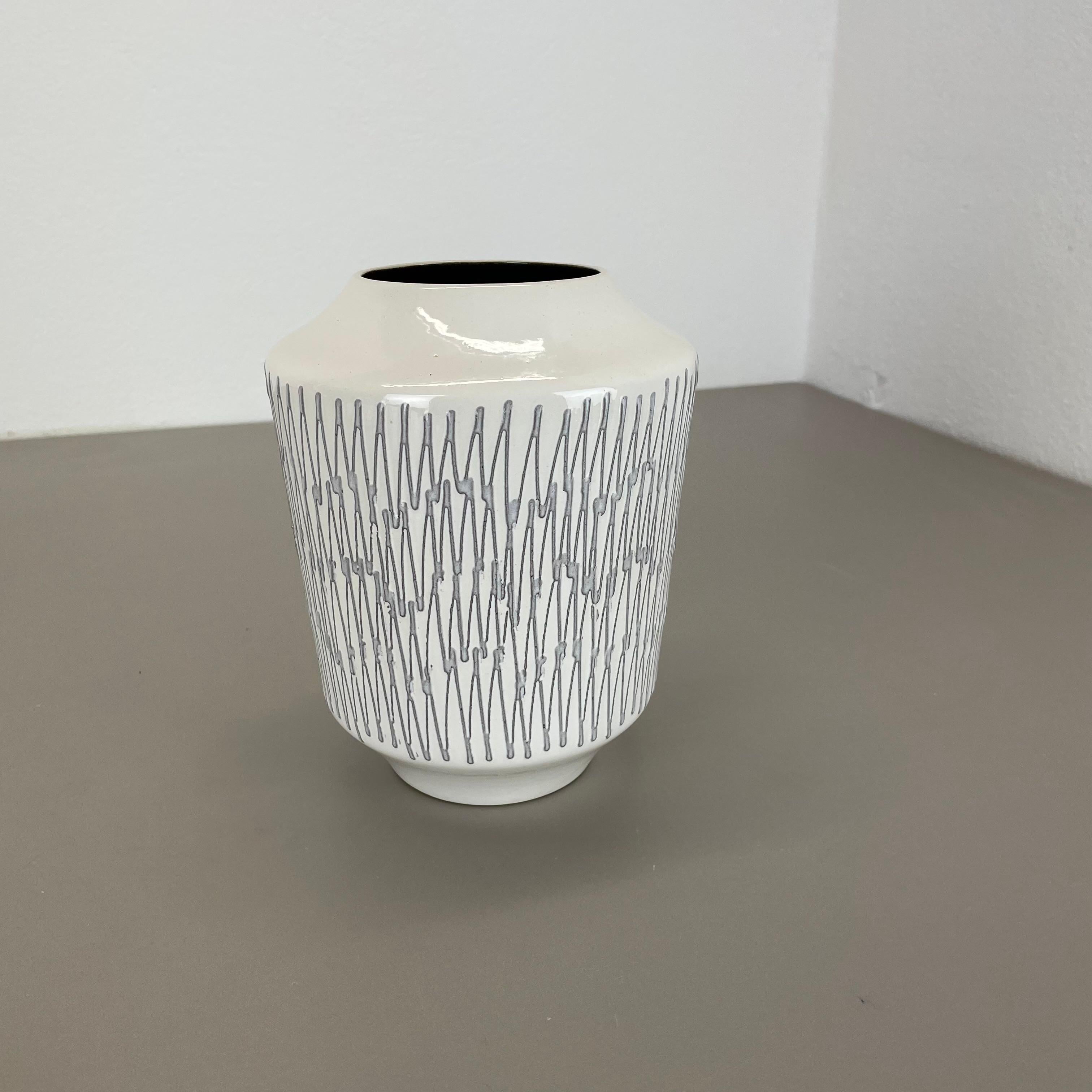 Article:

Pottery ceramic vase 


Producer:

ILKRA Ceramics, Germany


Decade:

1970s





Original vintage 1970s pottery ceramic vase made in Germany. High quality German production with a nice abstract brutalist surface glaze. The vase was